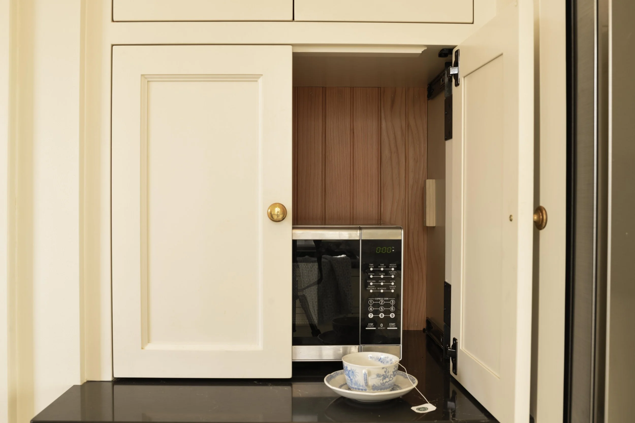 Built-in microwave cabinet with custom doors in Minneapolis kitchen renovation