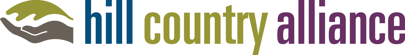 Logo for Hill Country Alliance featuring stylized green and gray hills with the words 'hill country alliance' in blue, green, and purple text.