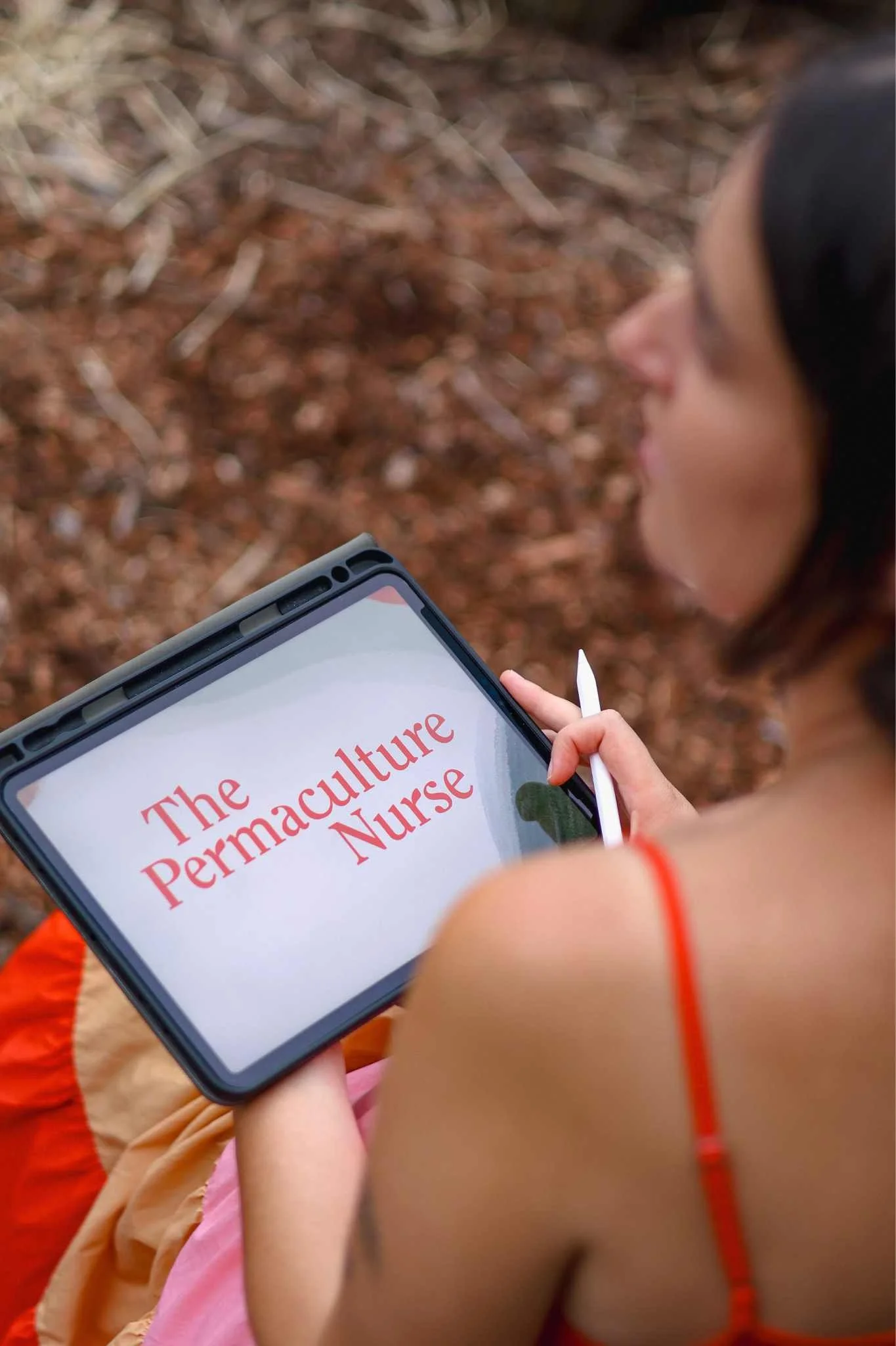 Cas with iPad with TPN logo.jpg