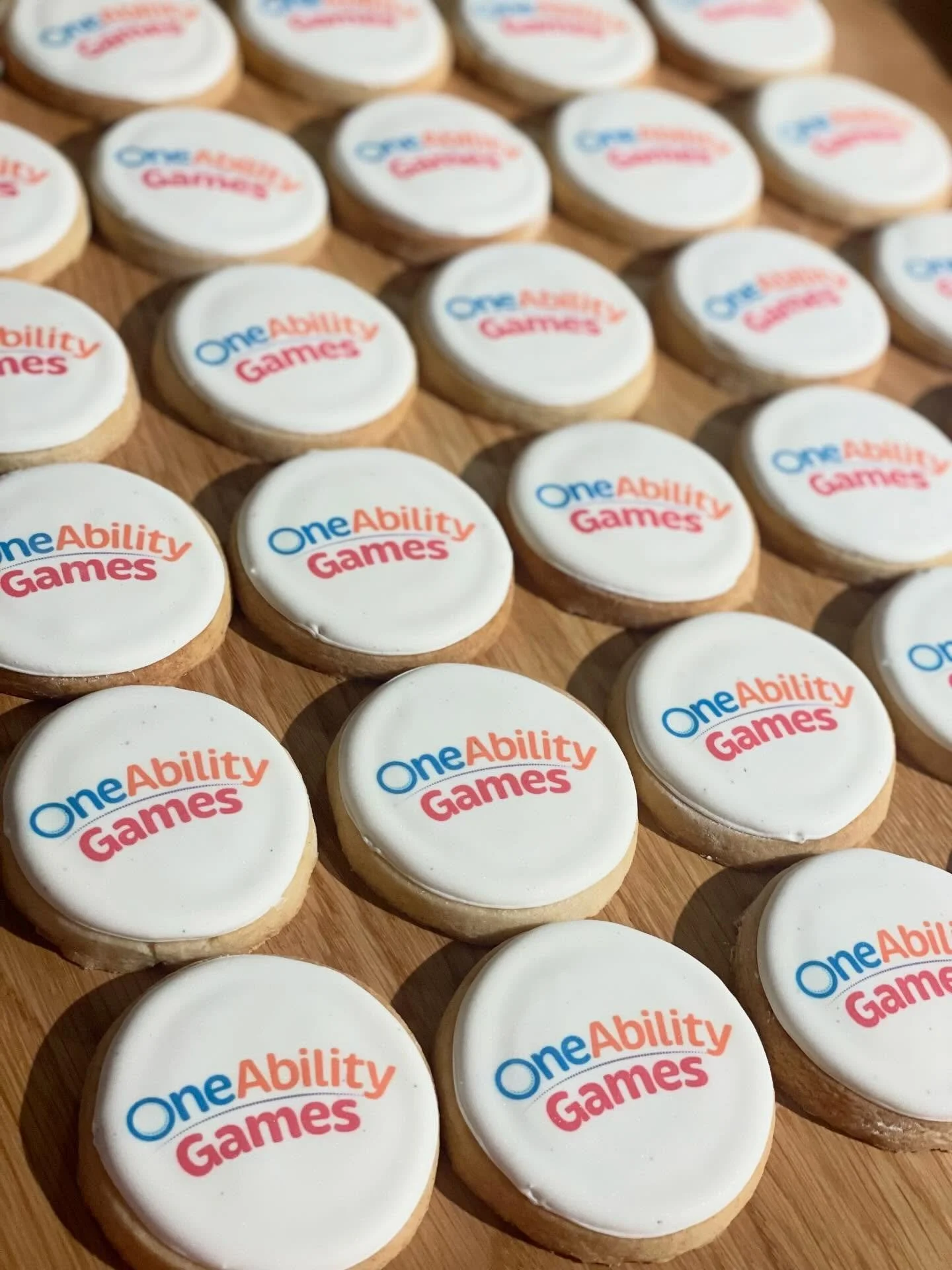 Proof that OAG is pretty sweet&mdash;and more inclusive sport opportunities is the icing on top. 🍪✨ 

Image description: Rows of white iced sugar cookies with the multi-coloured &ldquo;OneAbility Games&rdquo; logo on top of each of them. 

#OneAbili