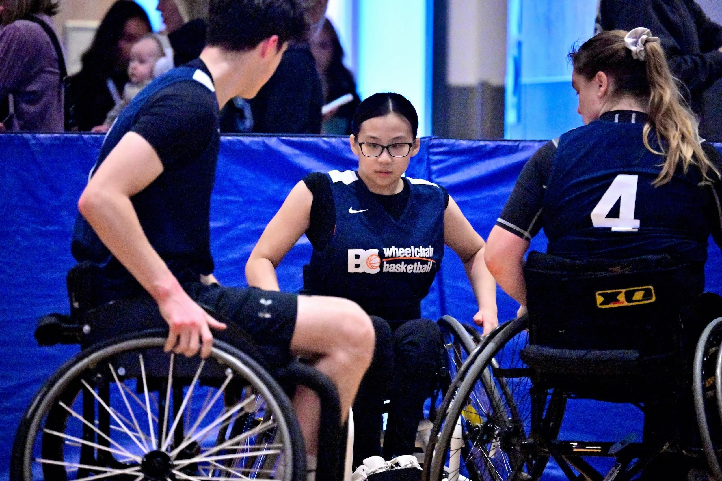 Elite wheelchair basketball players in a game.