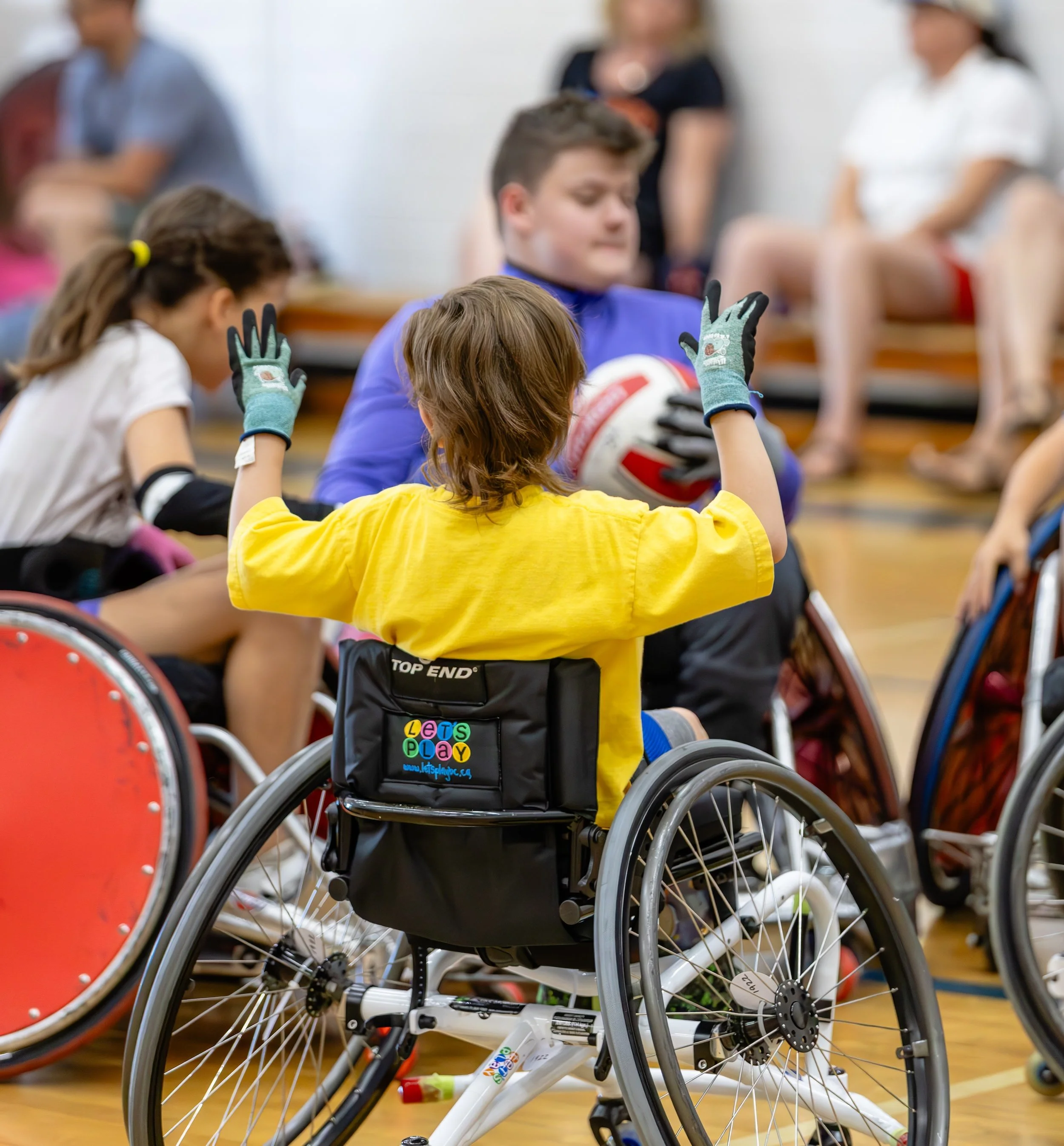 Young student playing wheelchair sport