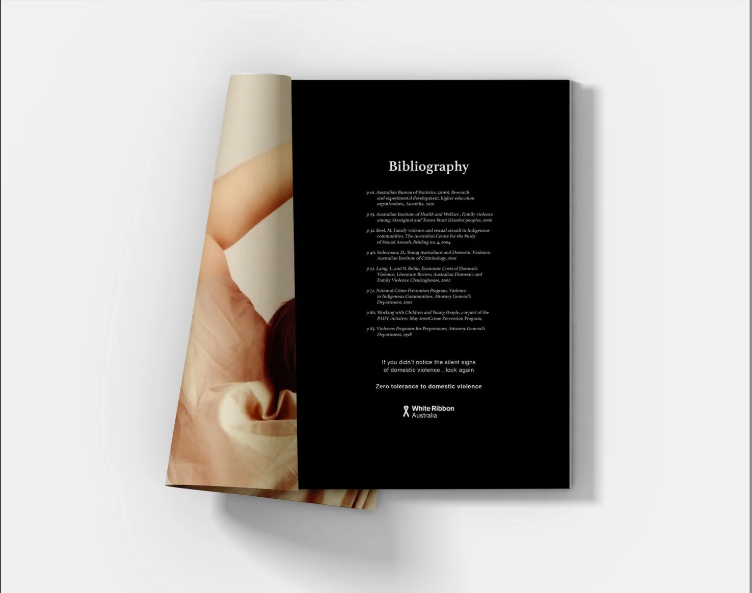Open booklet with a black page titled 'Bibliography' and a background image of a person with their hand resting on their forehead, hair deep red, on a beige fabric surface.