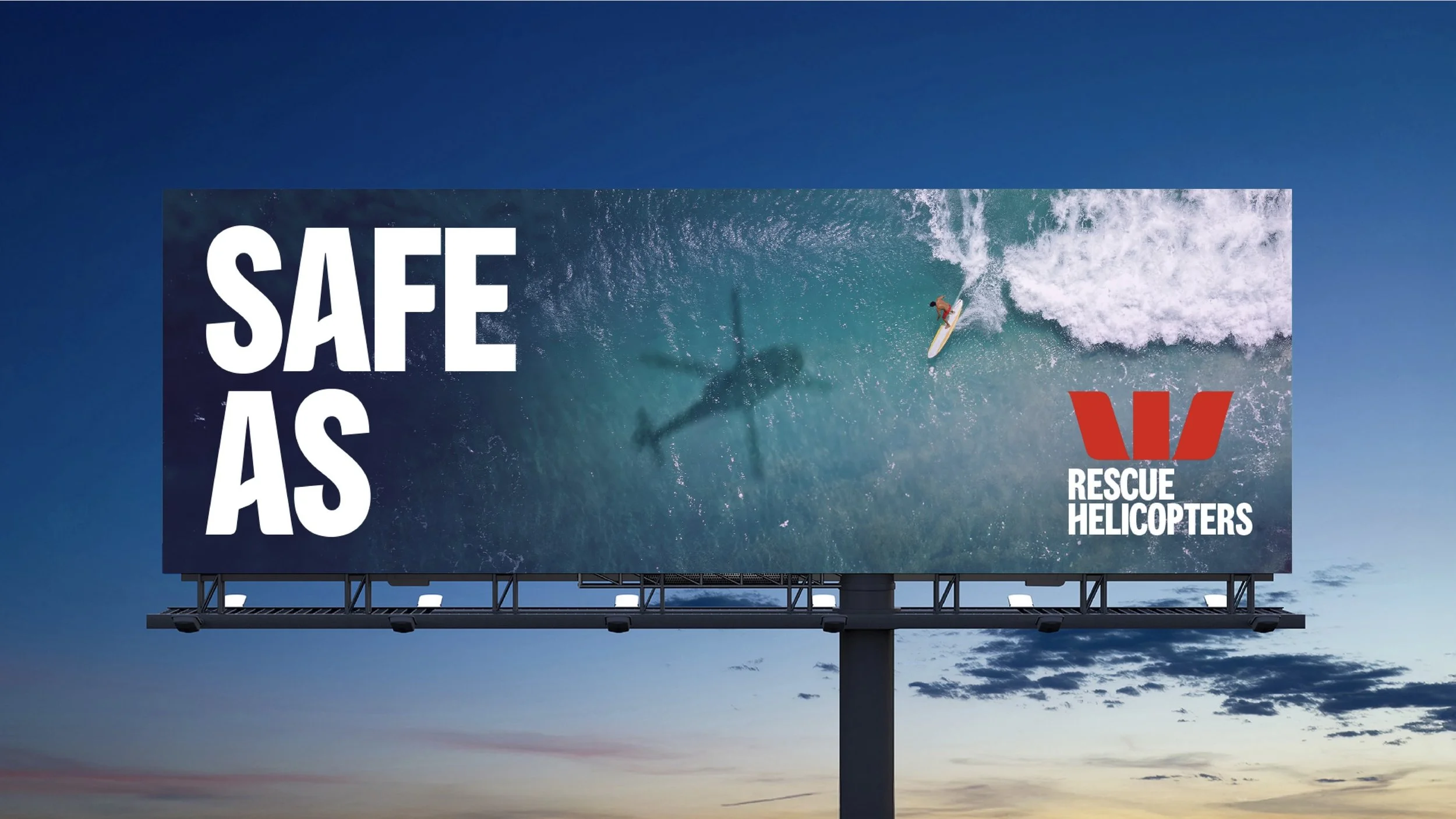 Billboard advertising rescue helicopters with a background image of a surfer riding a wave.