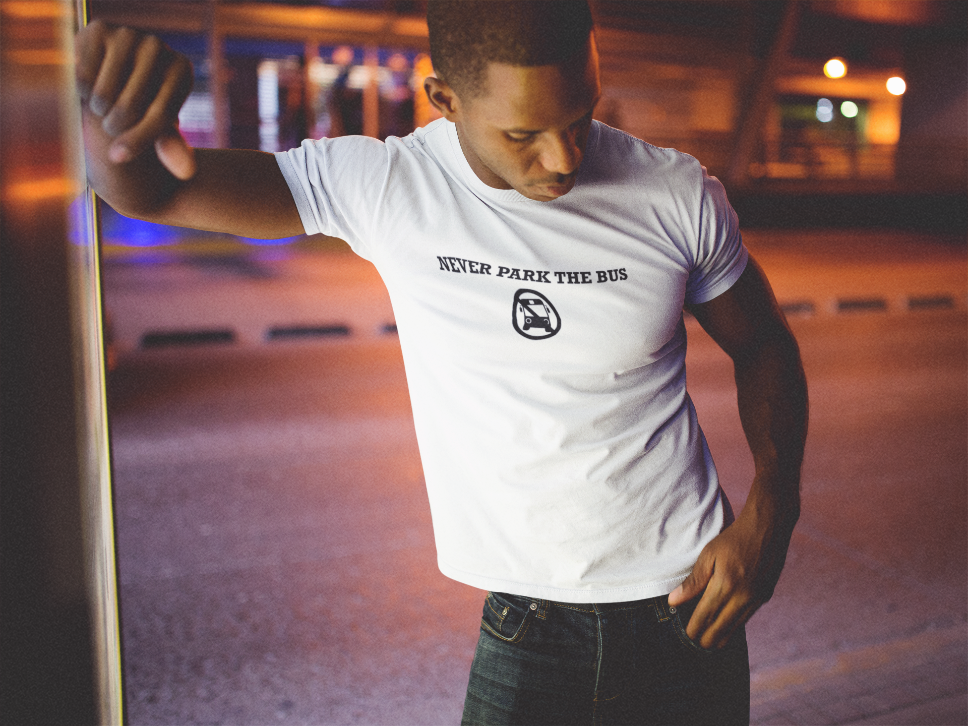 template-of-a-black-man-lying-against-a-bus-stop-mupi-while-wearing-a-t-shirt-a14234.png