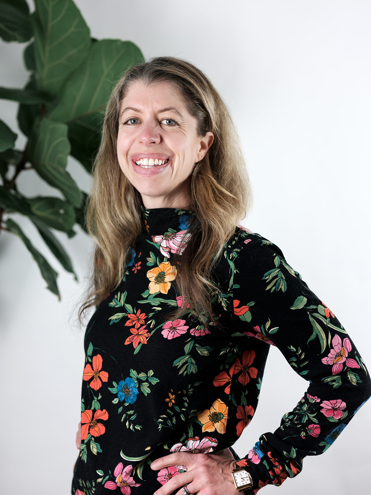 Leslie Kincaid smiling wearing floral dress