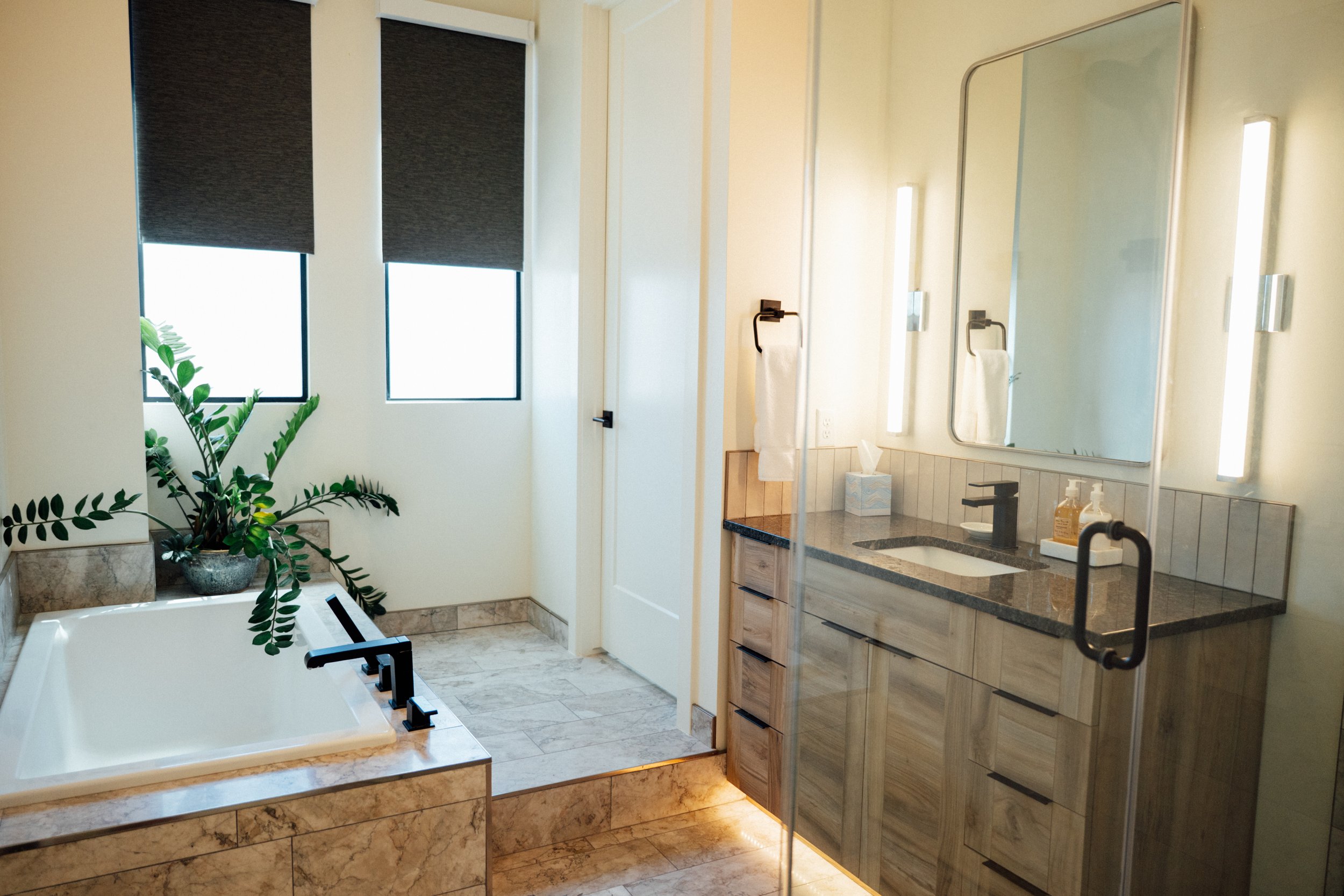 Movara Villa Primary suite bathroom with large soaking tub and vanity. 