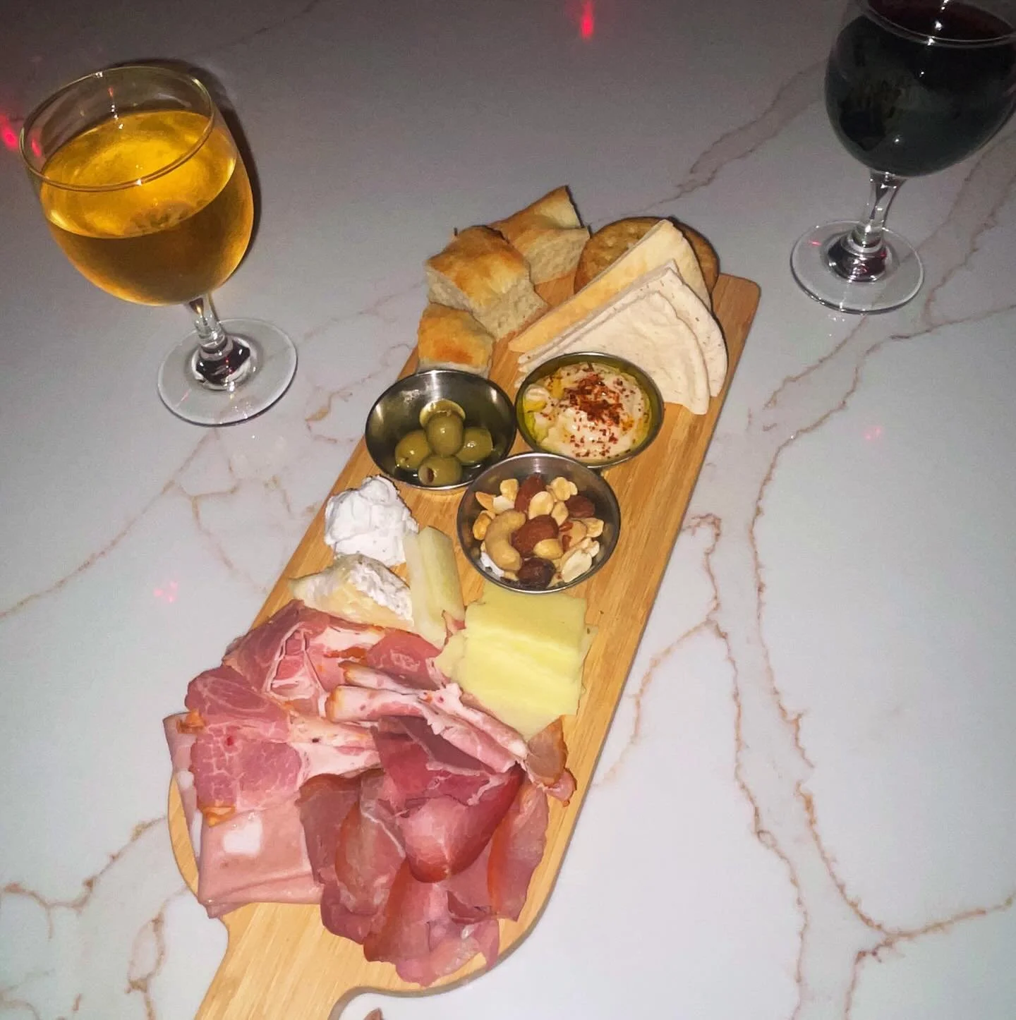 Prosciutto. Mortadella. Capicola.
Brie, Manchego, n Goat.
Warm Focaccia n Pita.
Delicious Hummus.
Great Wine. 
Better company.

This isn&rsquo;t just a charcuterie board.
It&rsquo;s your excuse to stay for one more glass.

Tag who you&rsquo;re bringi