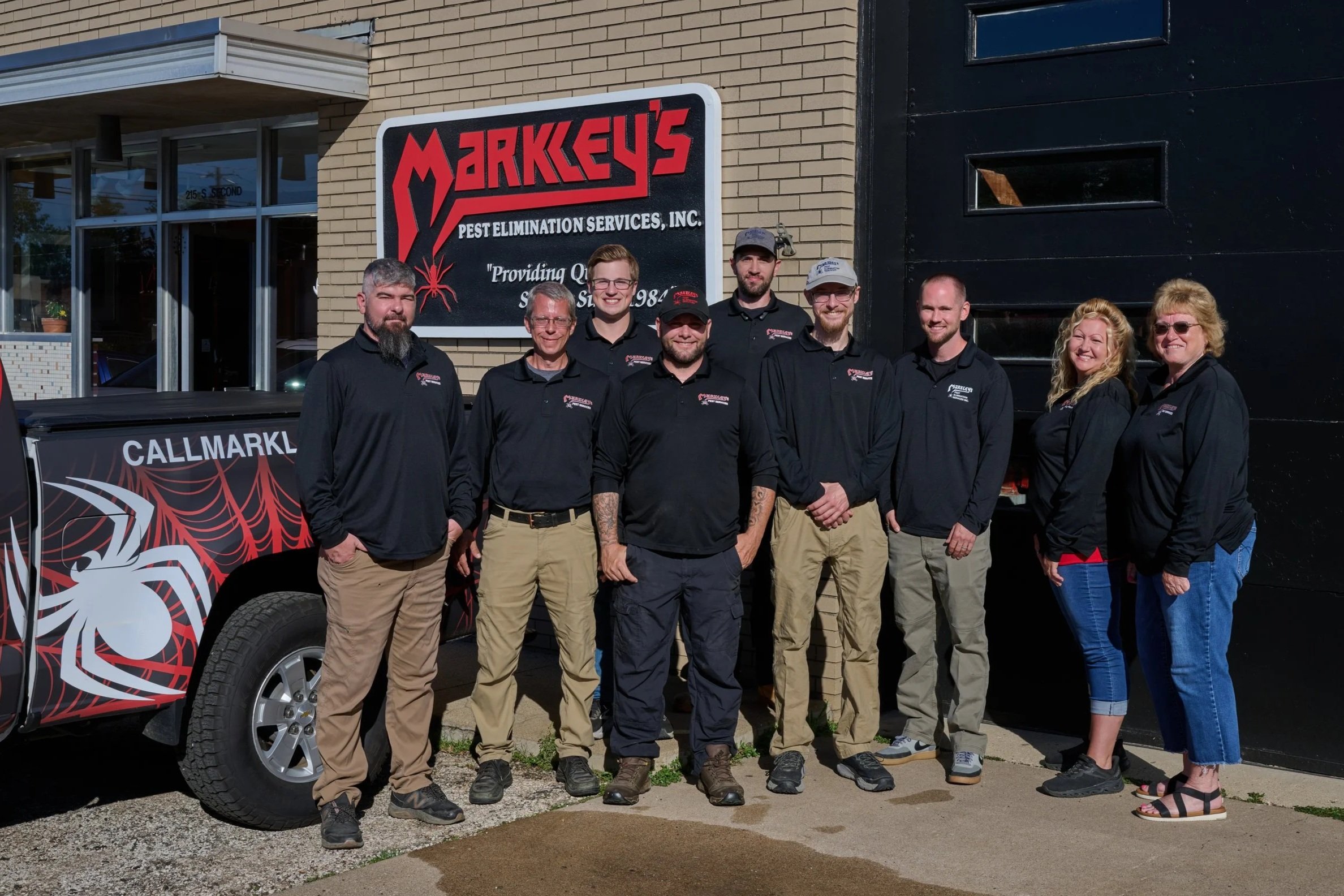The Markley's Pest Elimination Services team in front of their Morton, Illinois office and service truck.