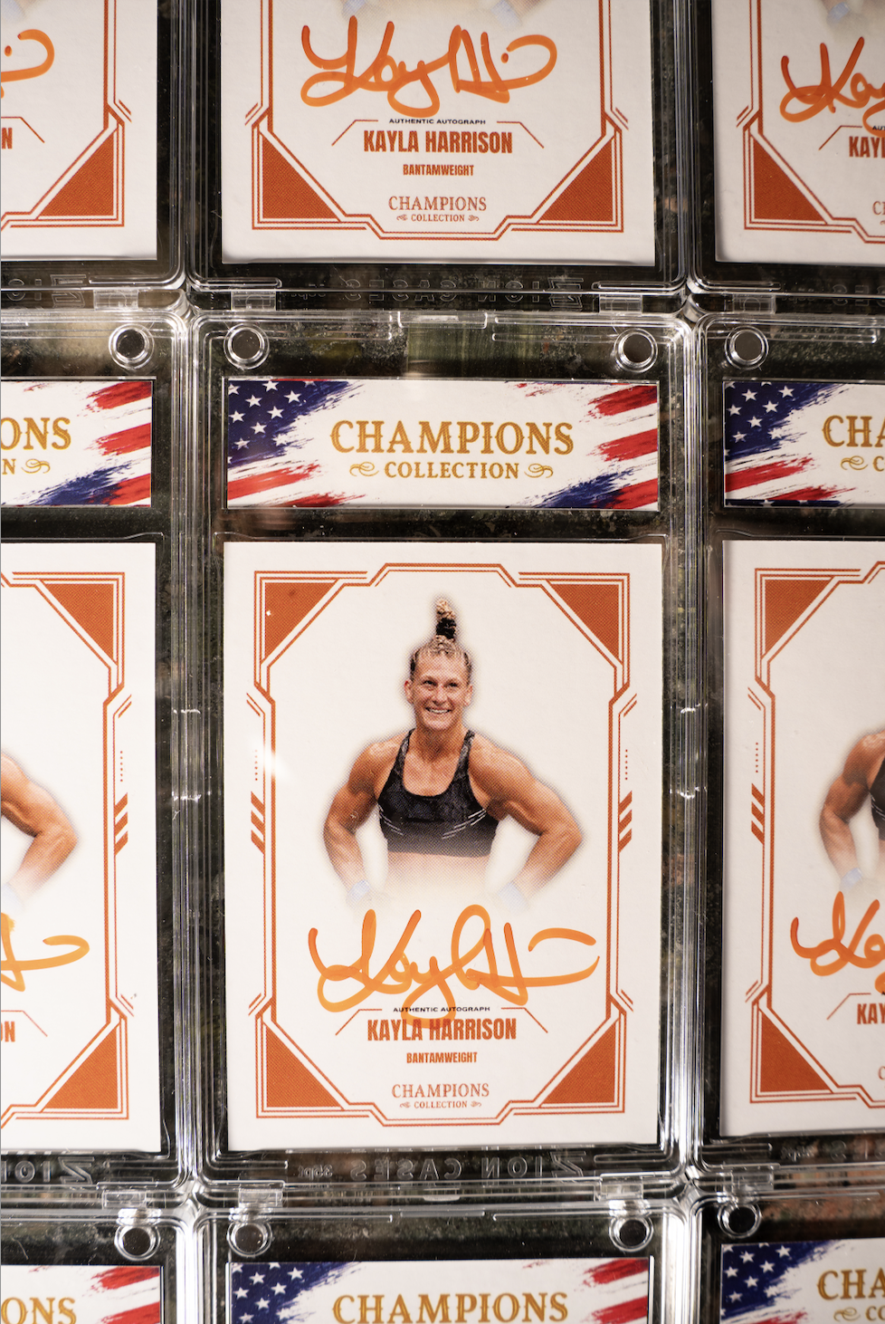 KAYLA HARRISON x CHAMPIONS COLLECTION AUTOGRAPHED CARD ORANGE (PSA)