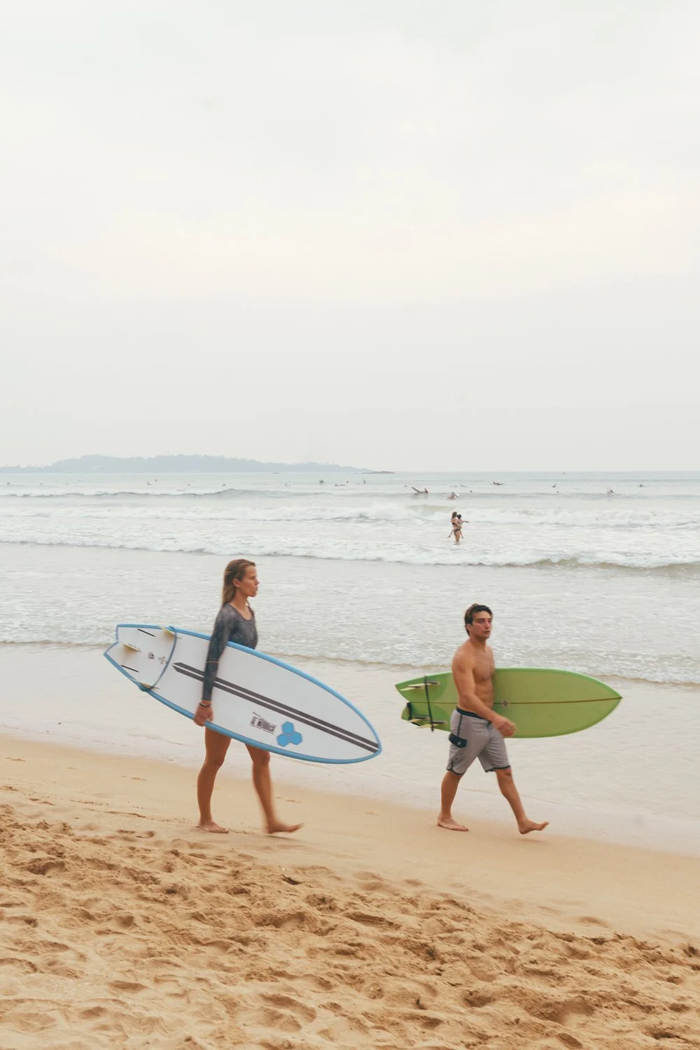 Surfers in Weligama Beach
