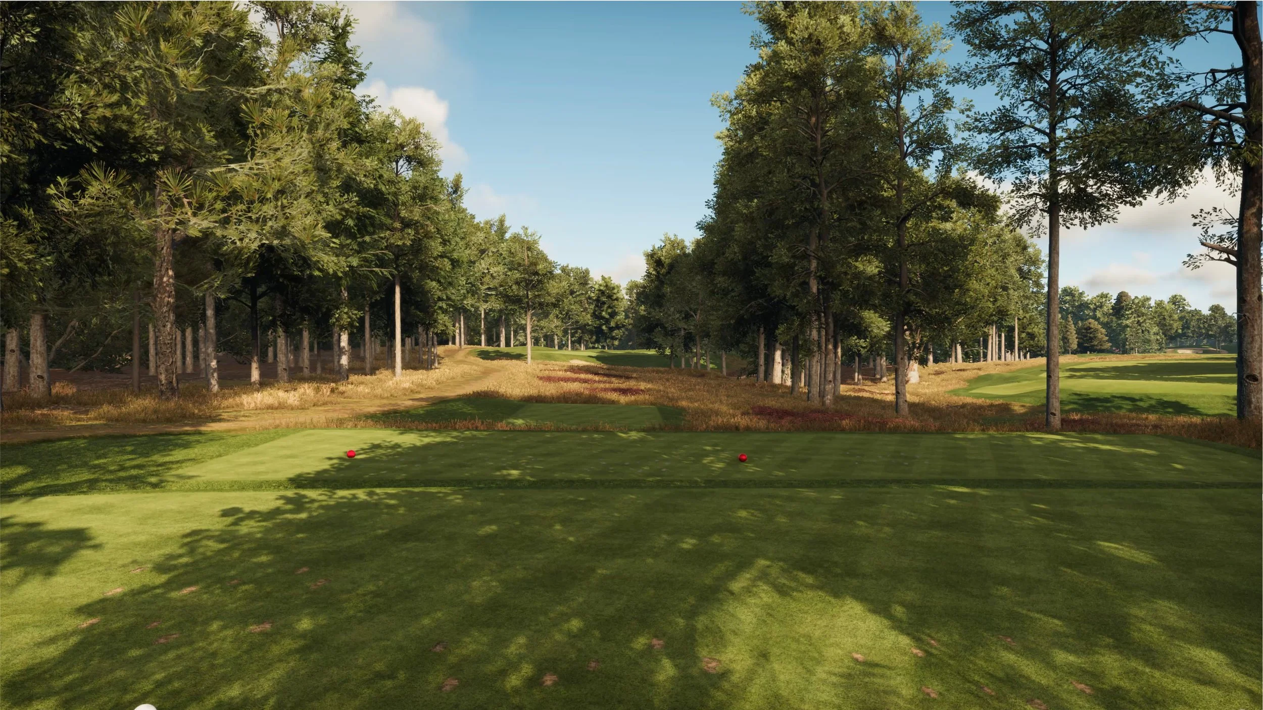 Wentworth West Course Golf course tee box with trees and fairway under a blue sky.
