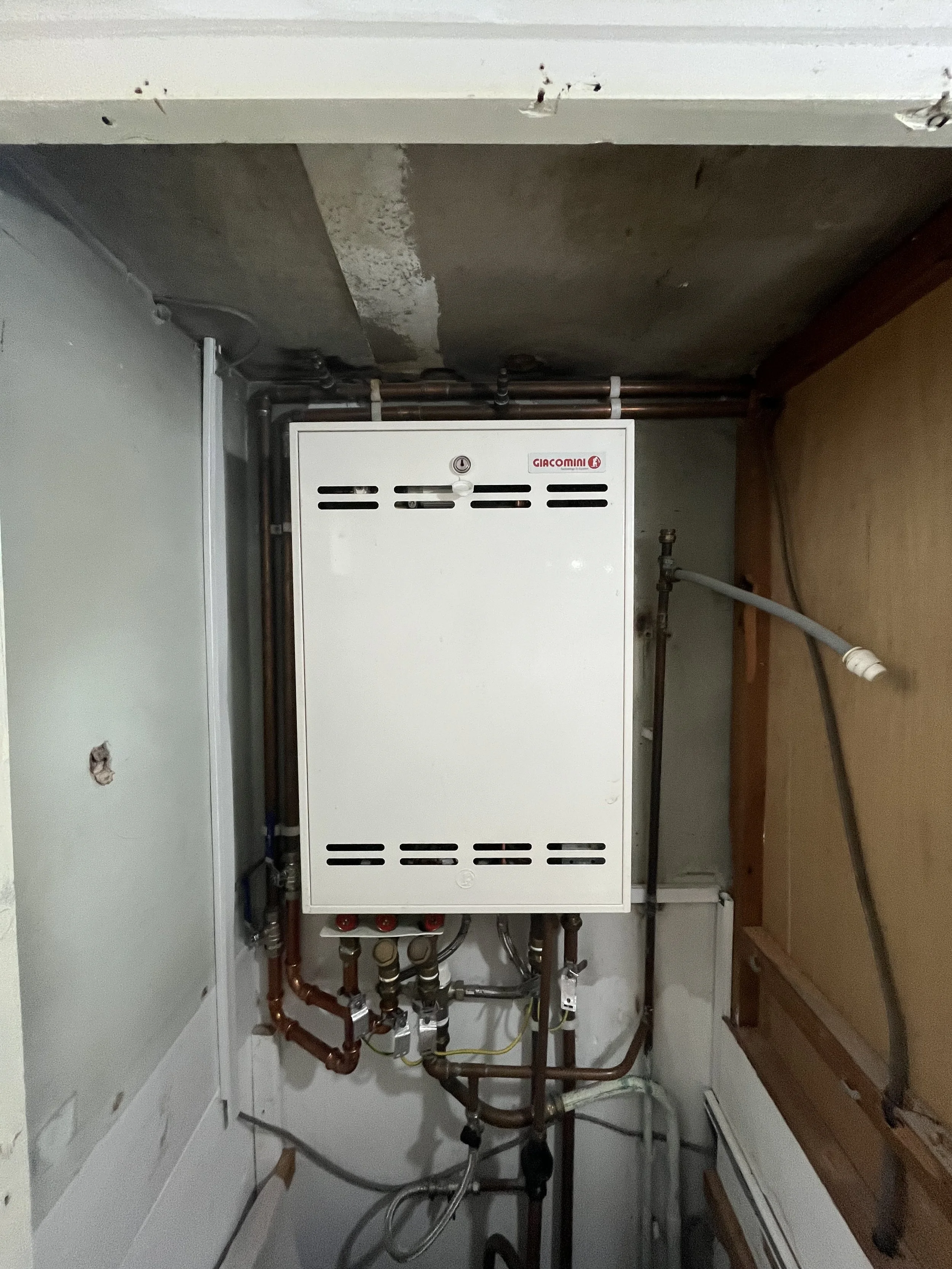 Giacomini heat interface unit installed in residential apartment block