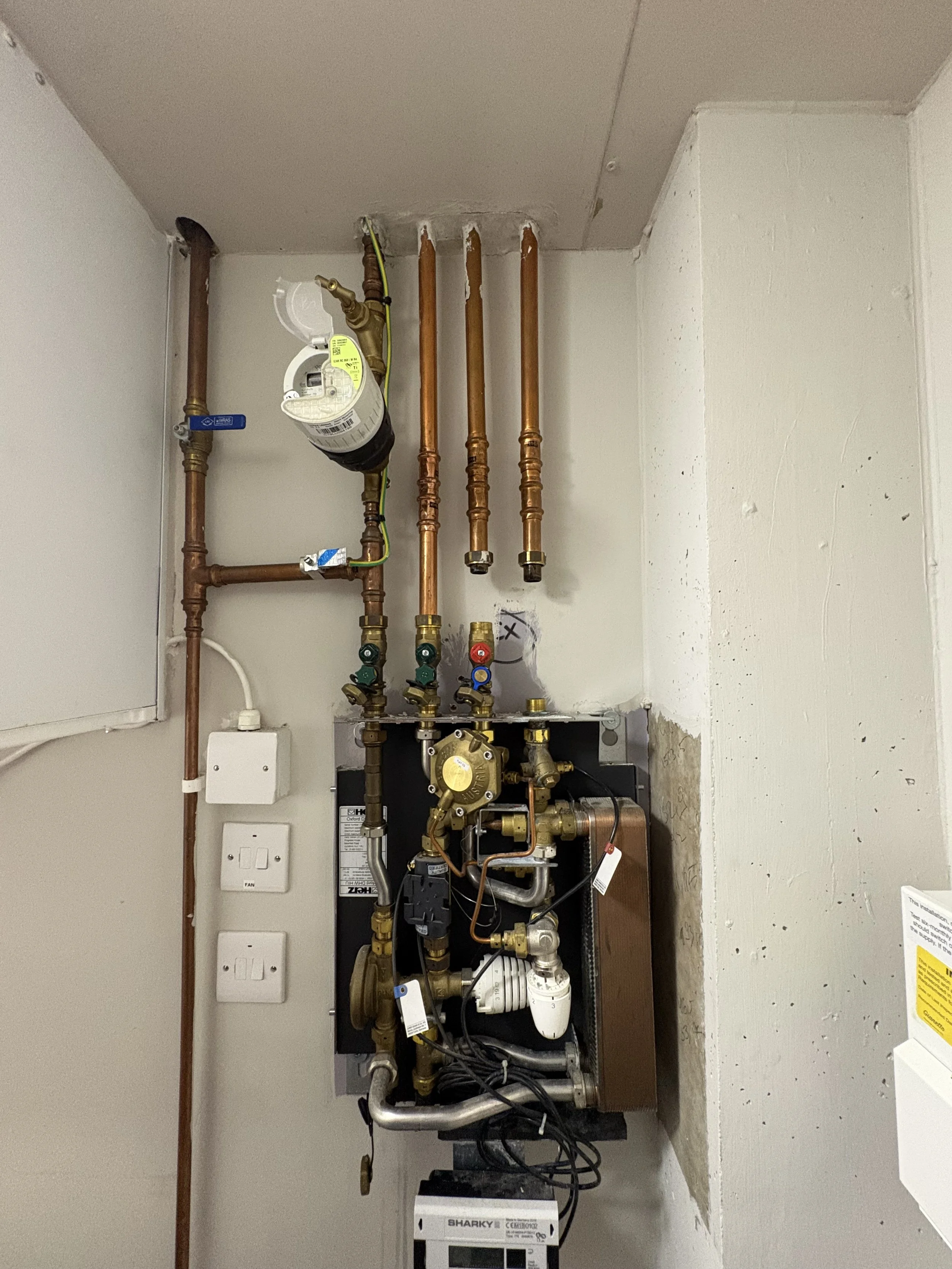 Replacing primary isolation valve and drain-off valve on Herz Oxford DHW HIU during repair, Manchester