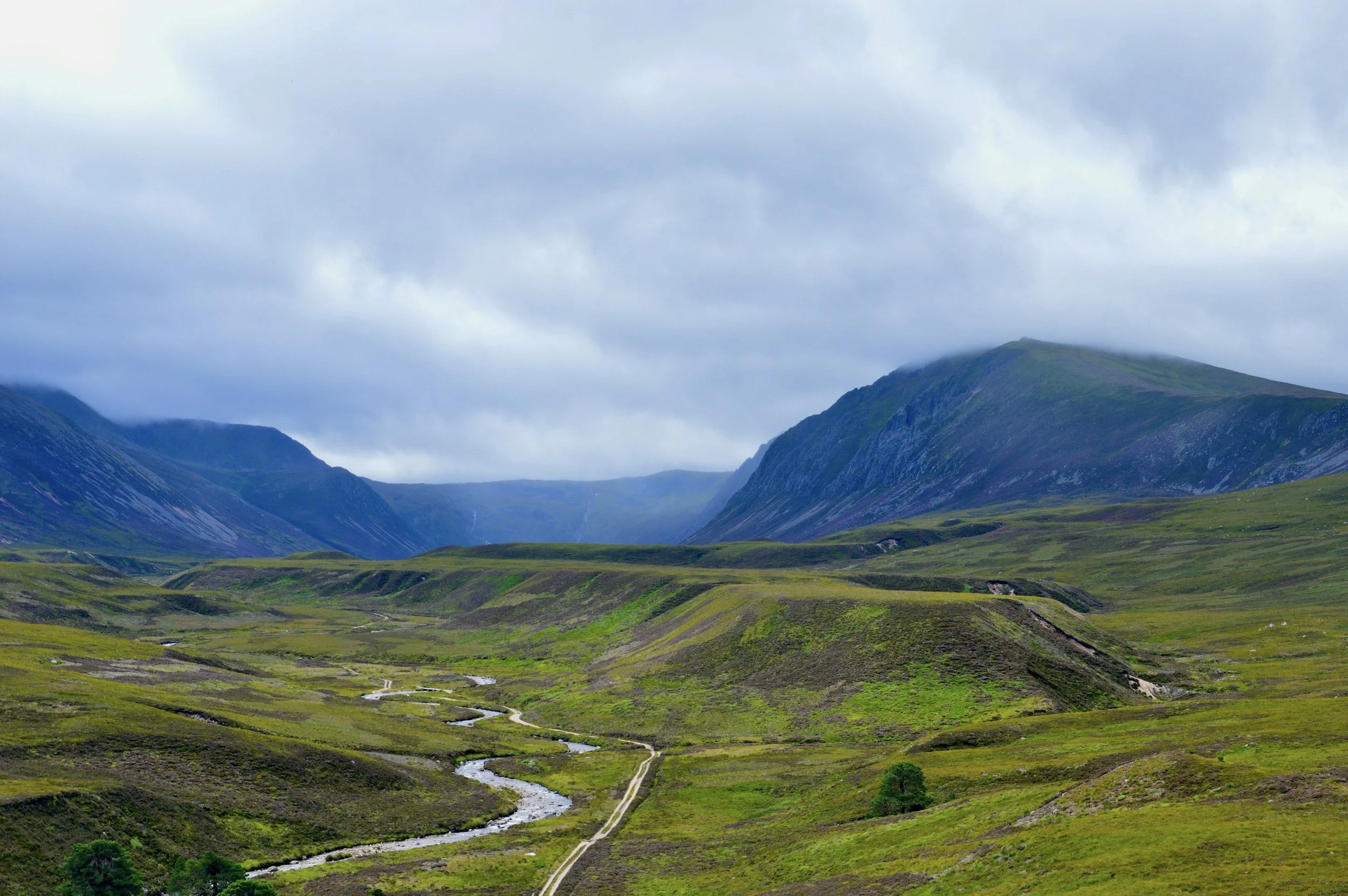 Green valley and rolling hills in Scottish Highlands