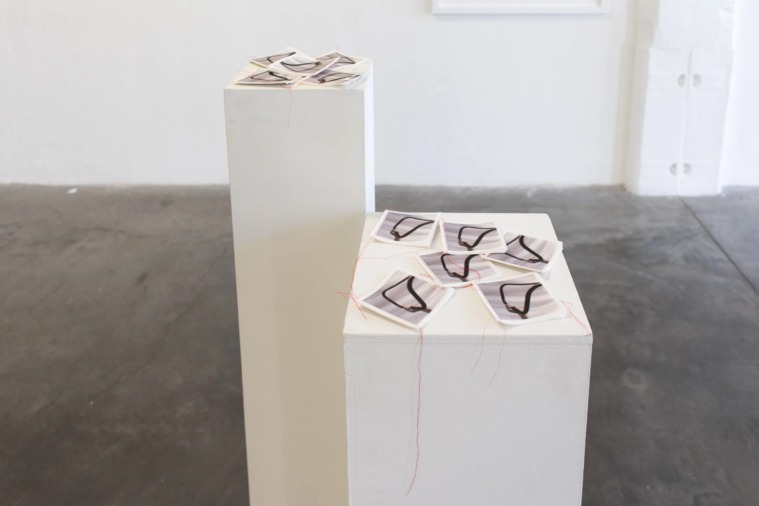 Installation of booklets. Inkjet prints on rice paper, sewn together. Scanned hand-coloured prints from digital images. 2025.