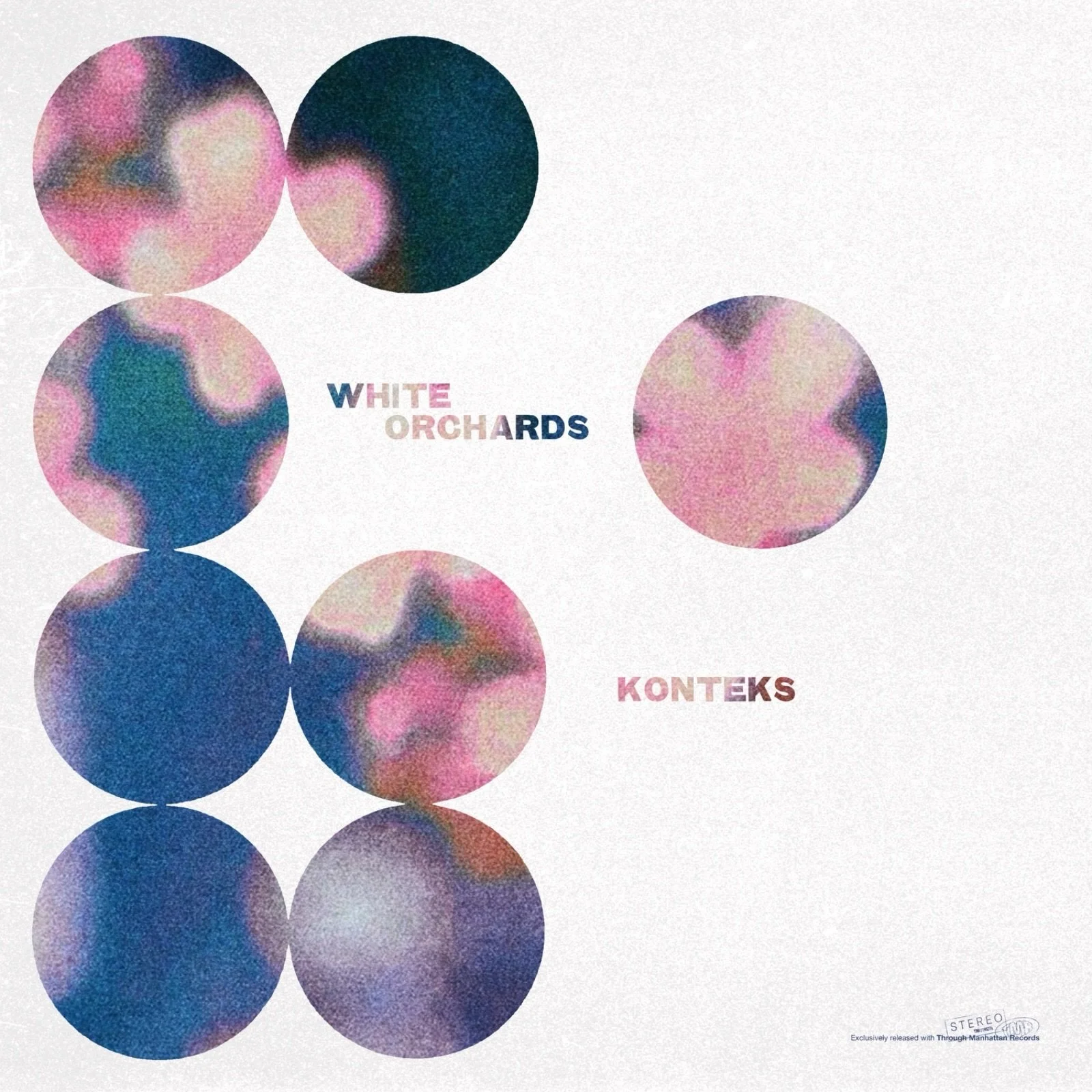 An abstract album cover with colorful, blurred circles and text that reads "WHITE ORCHARDS KONTEKS" and a small logo indicating stereo sound.