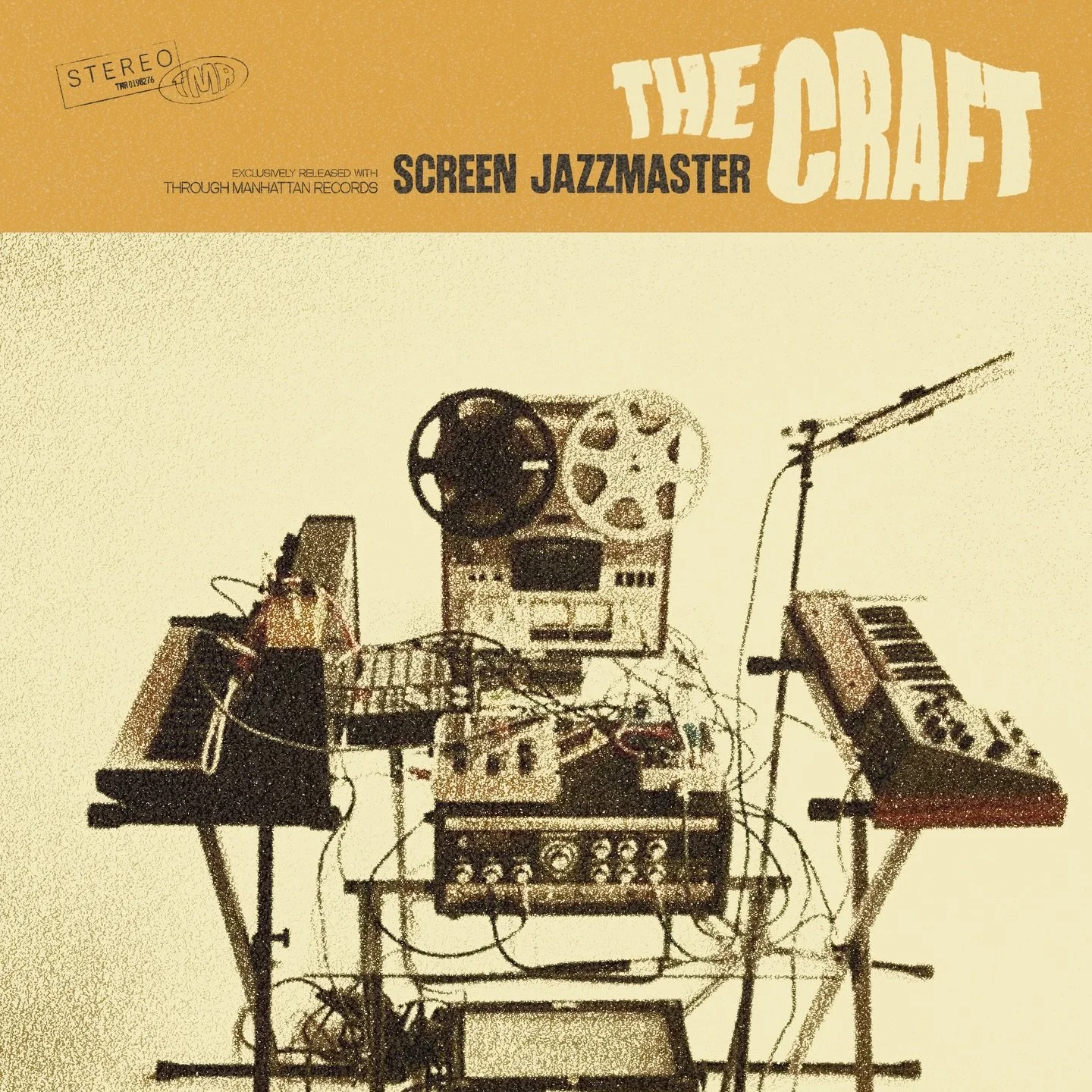 A collection of electronic music equipment including a reel-to-reel tape recorder, synthesizers, and various cables, arranged on tables in a music studio setup.
