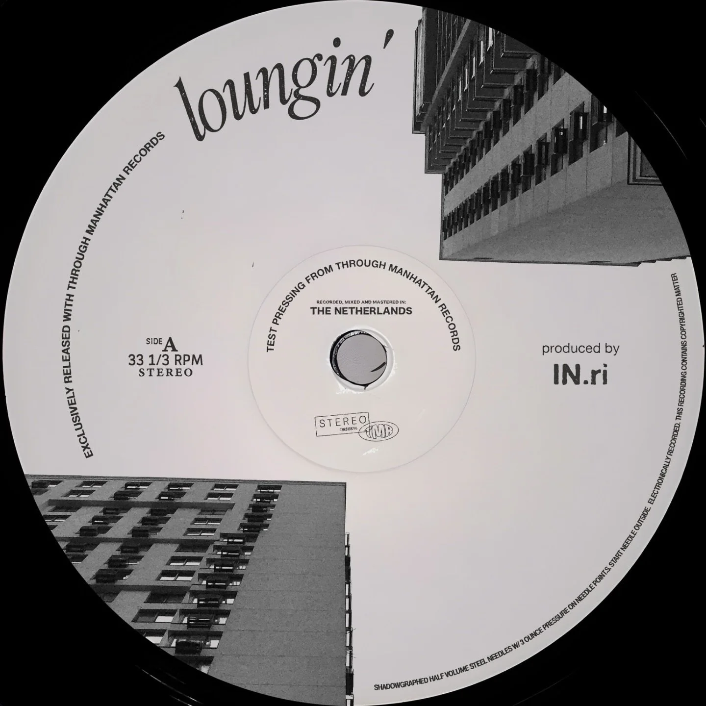 Black and white vinyl record label with the words 'Loungin'' and 'Produced by IN.r'