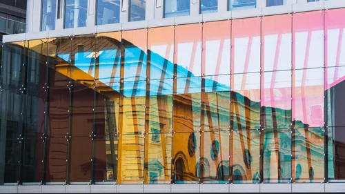 Modern glass building facade representing building energy efficiency audits by Oxford Energy Services
