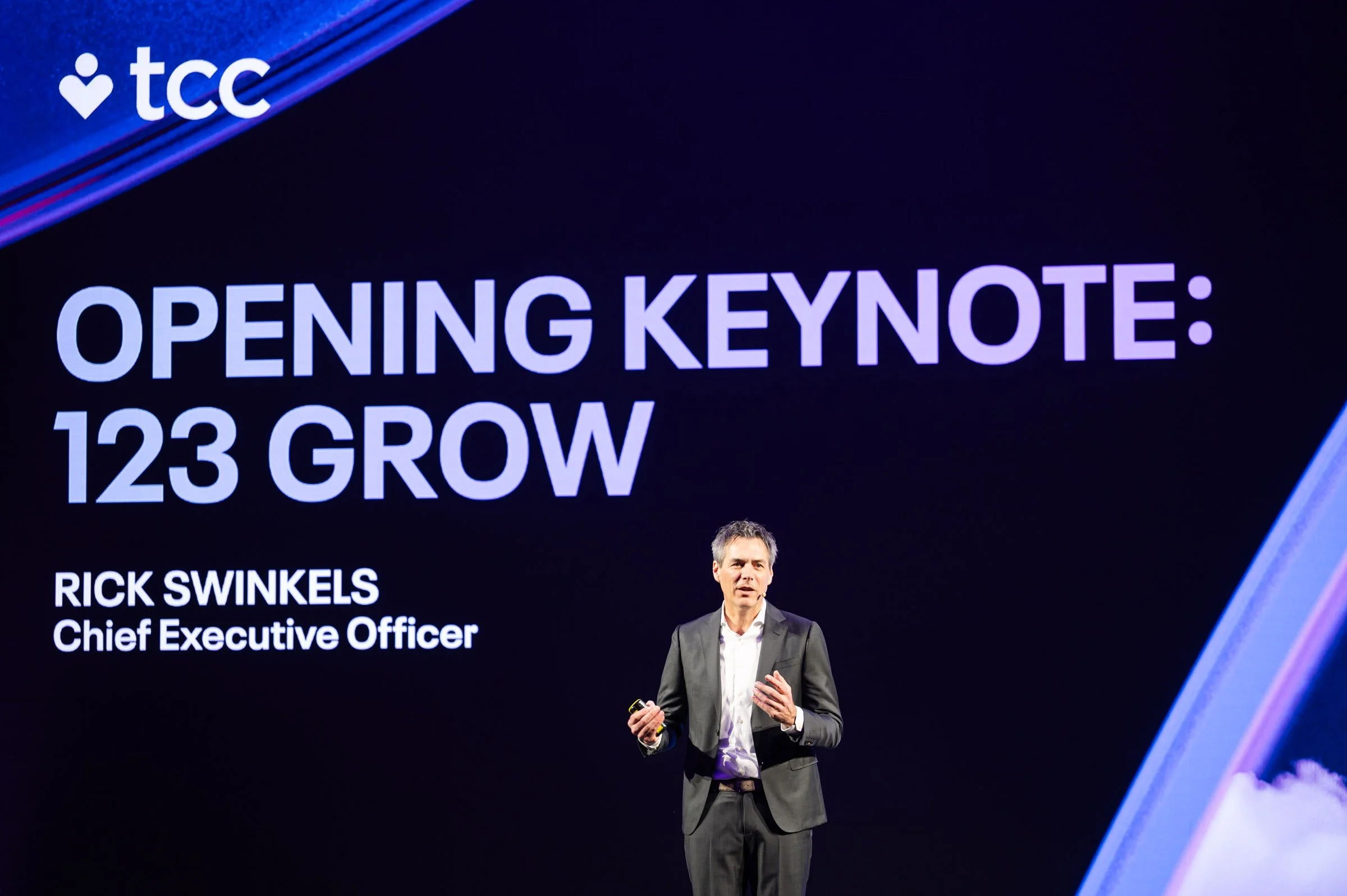 Corporate event photography in Prague – keynote speaker presenting at international business conference.