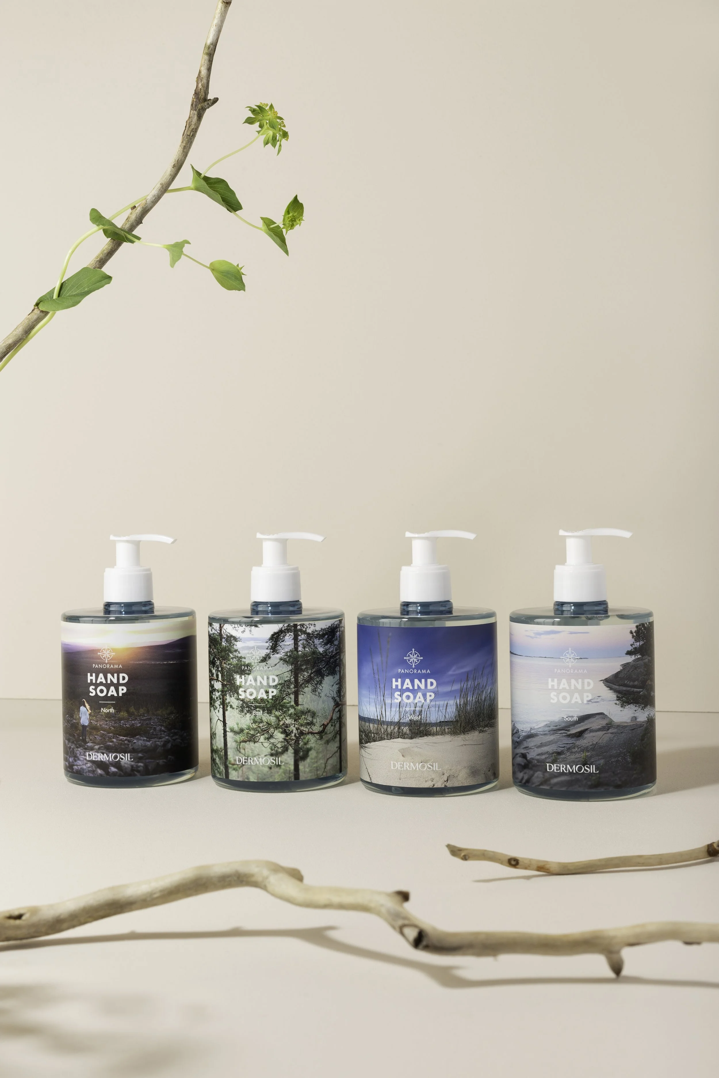 Sesongin uudet käsisaippuat tuotekuvassa rekvisiittana männynoksia ja lehtiä