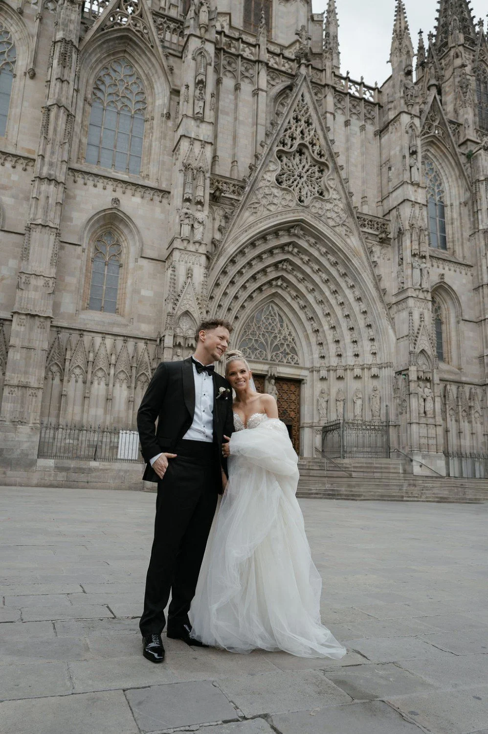 Newly married couple outside Barcelona Cathedral after their wedding ceremony