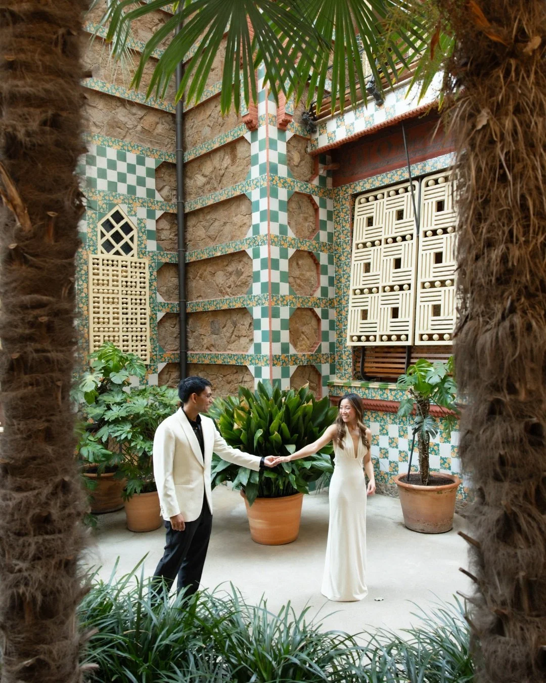 A quiet moment between the tiles at Casa Vicens - Gaud&iacute;'s checkerboard patterns and ironwork as the backdrop, palms overhead. 

Barcelona doesn't need much staging when the architecture does this much of the work. 🤍

Photographer: @afweddingp