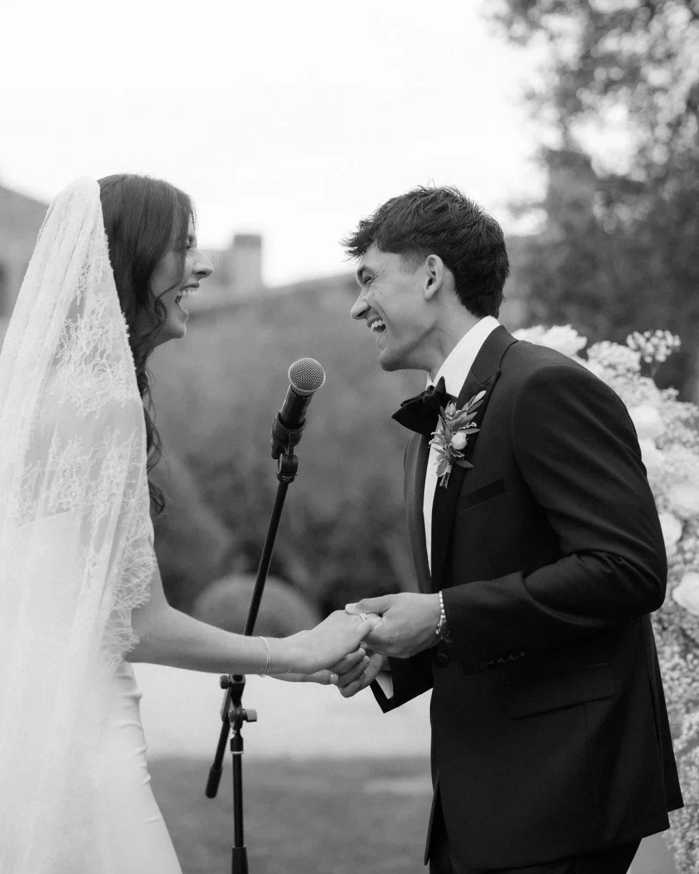 Couple laughing together during their wedding ceremony in Barcelona organized by PearlSandals