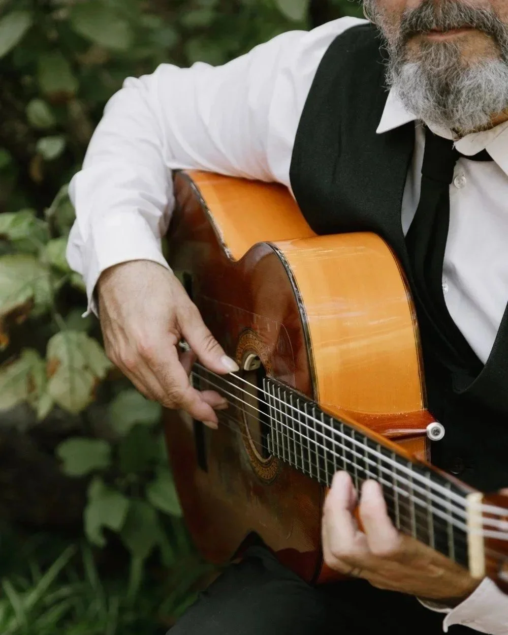Traditional Spanish guitarist performing at a destination wedding in Barcelona organized by PearlSandals