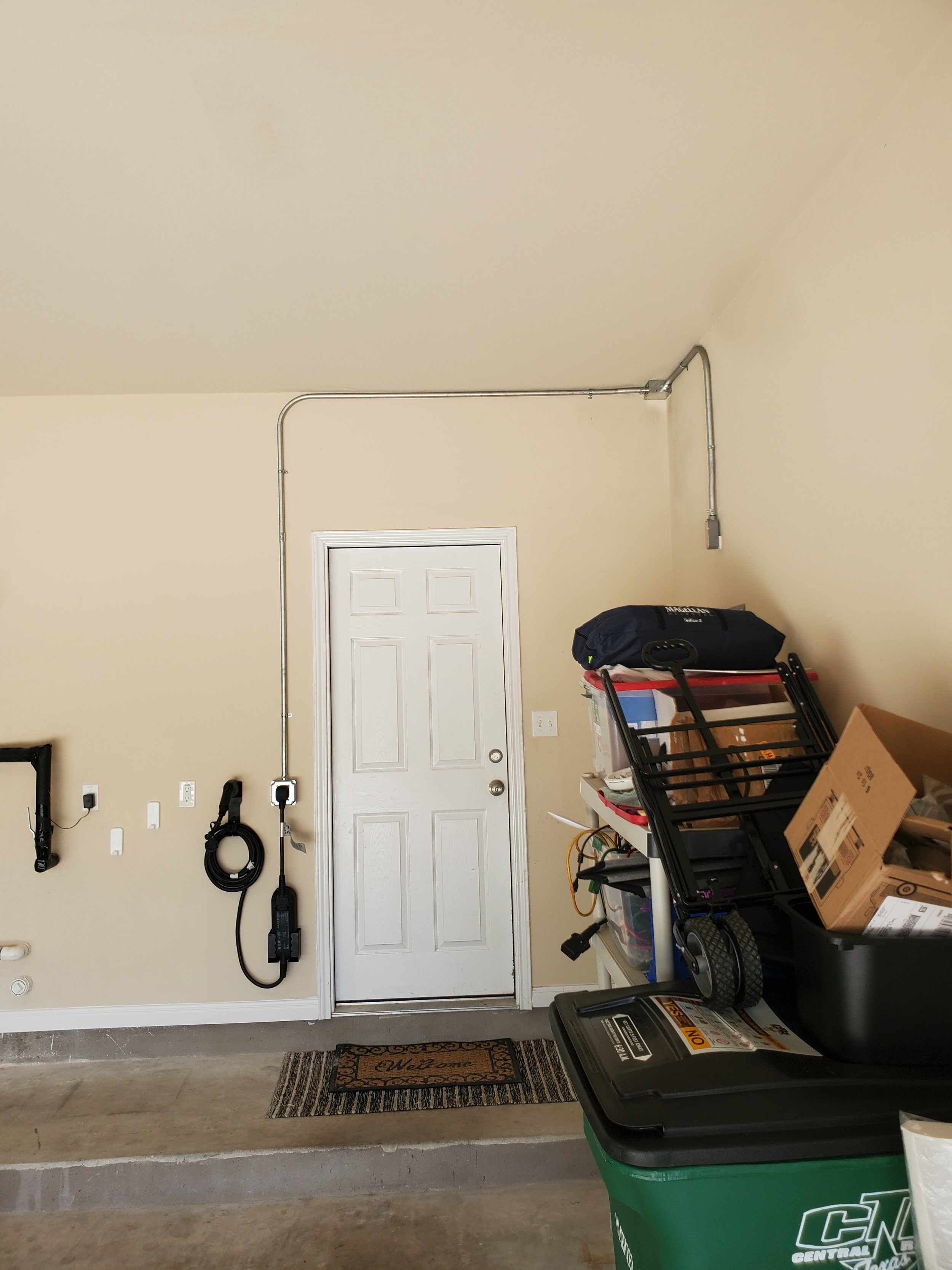 Optomax Electric. electrician. electrical contractor. EV chager install in garage