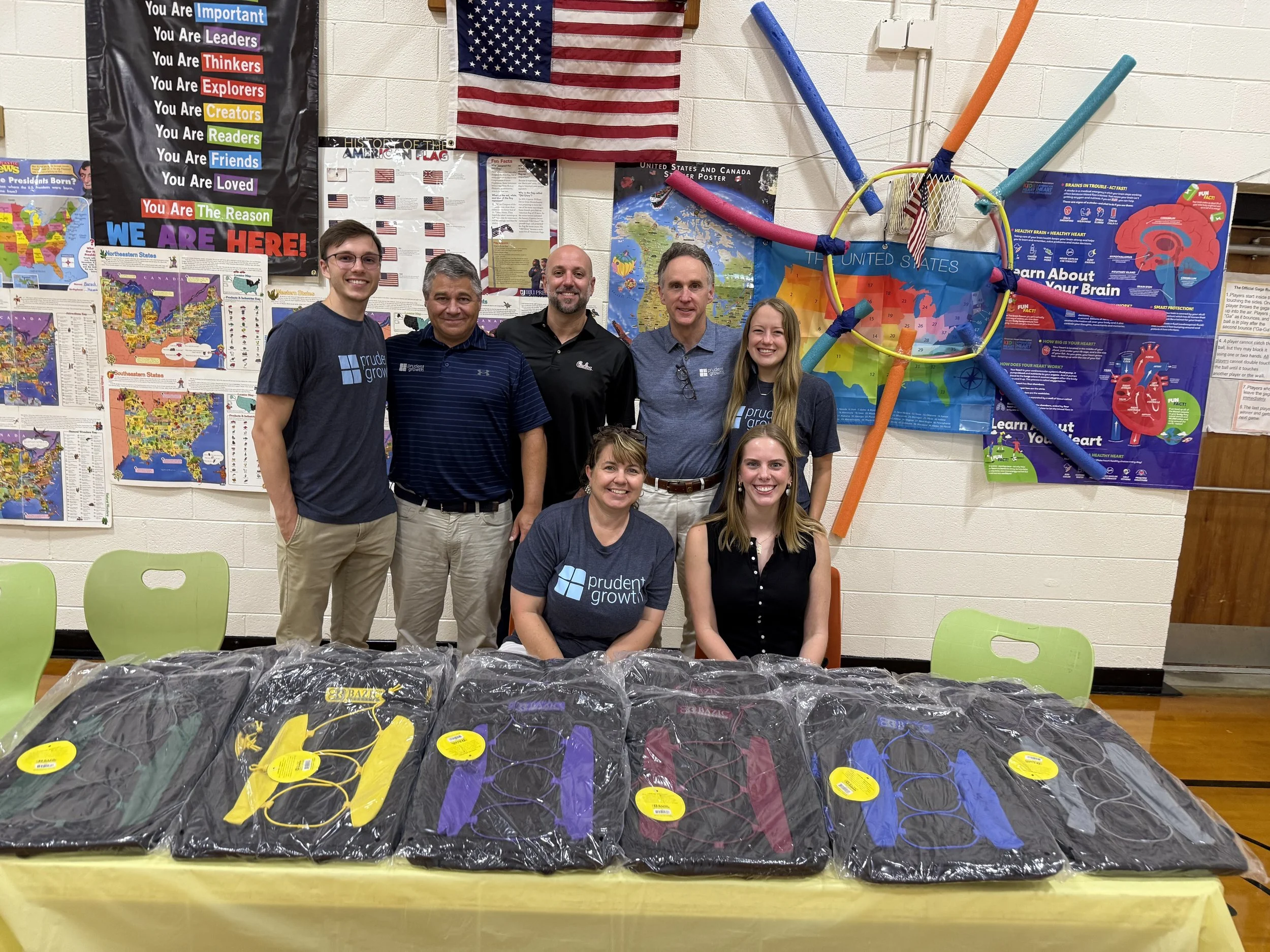 Prudent Growth Donates Backpacks & School Supplies
