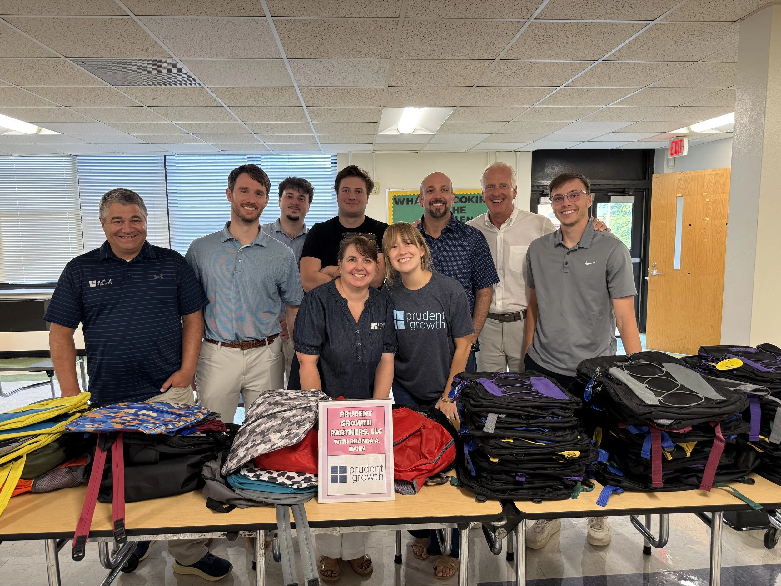 Prudent Growth &amp; Cornerstone Commercial Donate Backpacks 