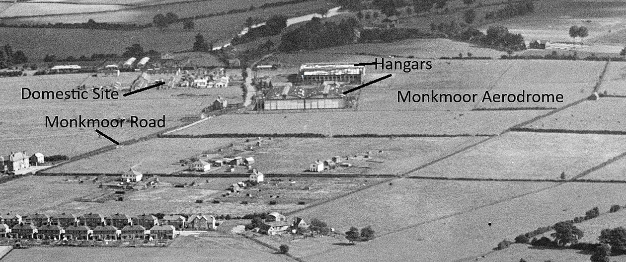 Aerial view of Monkmor Aerodrome with annotated labels pointing to hangars, domestic site, and road.
