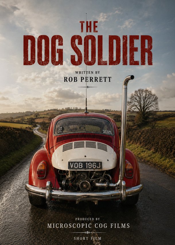 Title slide for a short film titled 'The Dog Soldier,' written by Rob Perrett and produced by Microscopic Cog Films. The background features a vintage red Volkswagen Beetle with its rear engine exposed, parked on a rural road with fields and a cloudy sky.