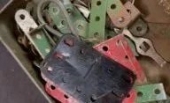Various colored and metallic bicycle brake pads.