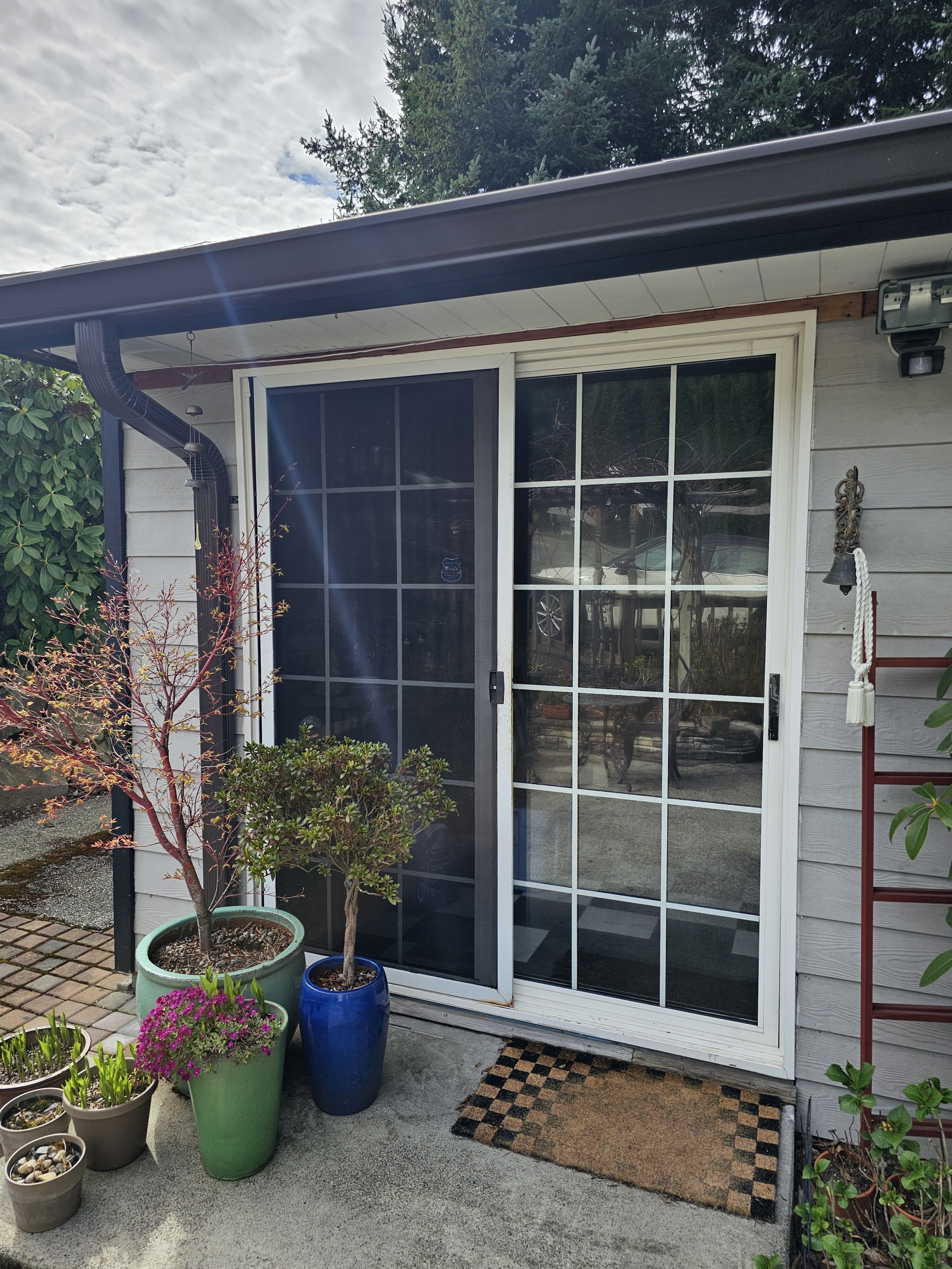 A picture of a door that leads into a house.