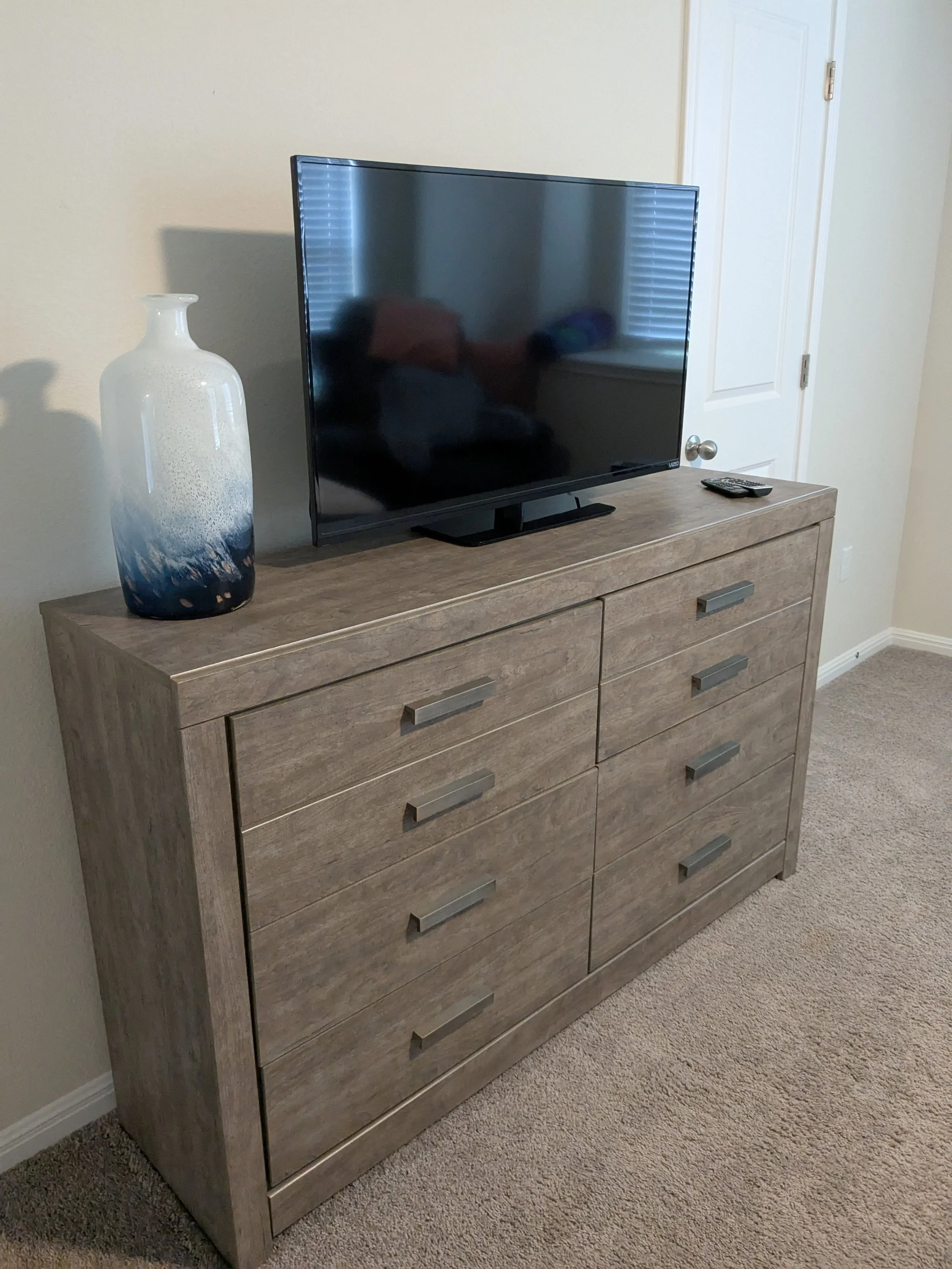 Dresser that has been anchored to the wall to prevent tip-over