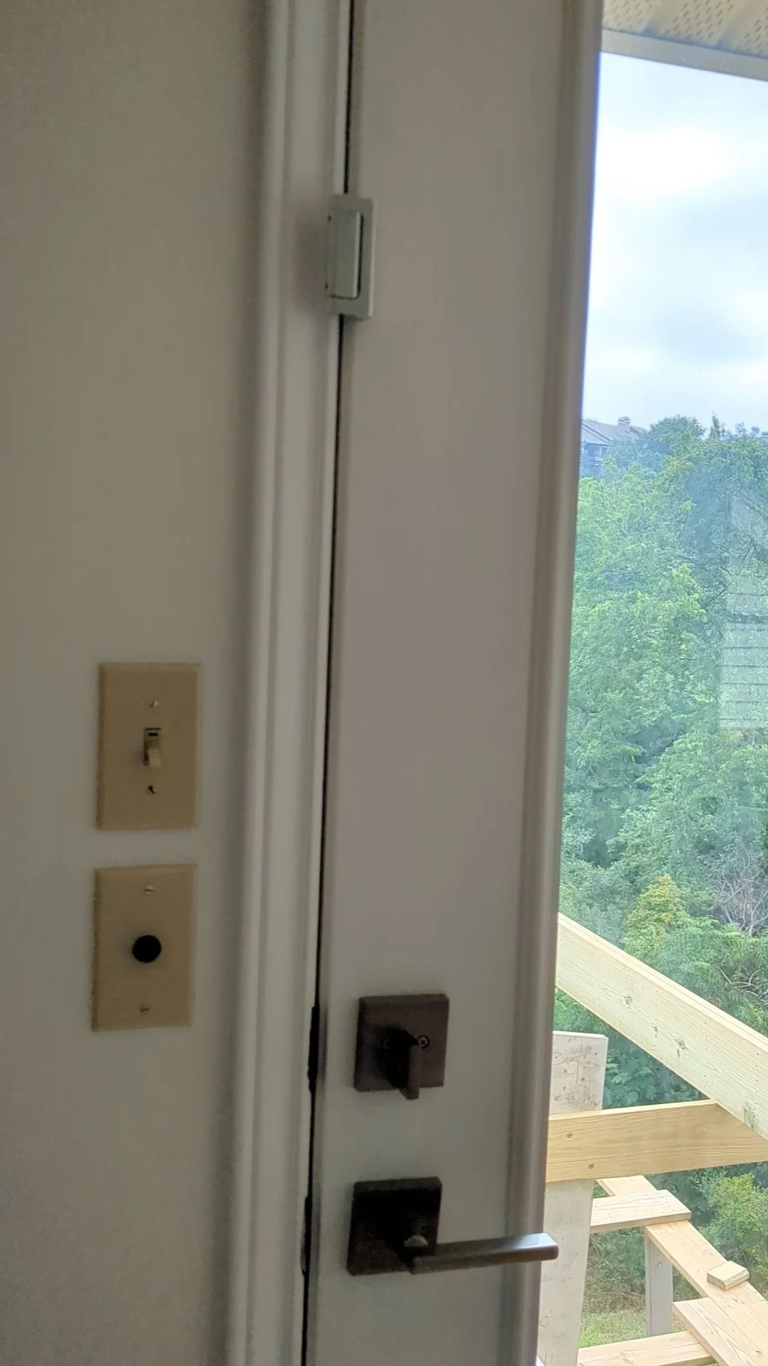 Door lock for babyproofing front and back doors that also functions as a security lock
