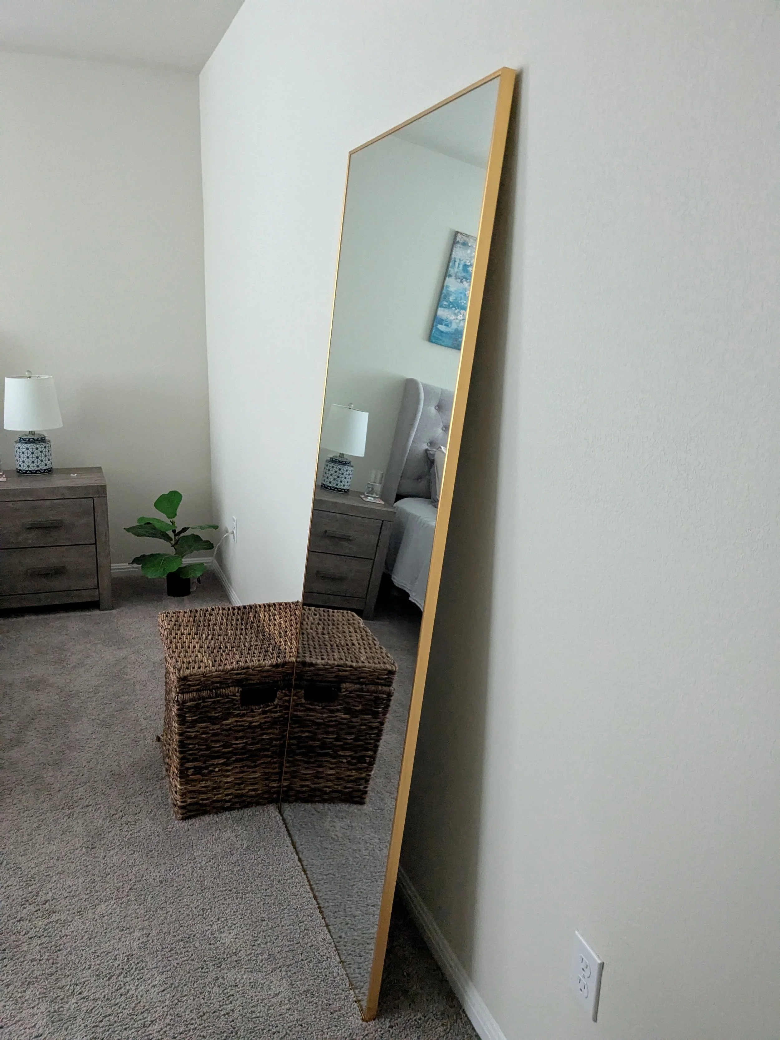 Mirror that has been anchored to the wall to prevent tip-over
