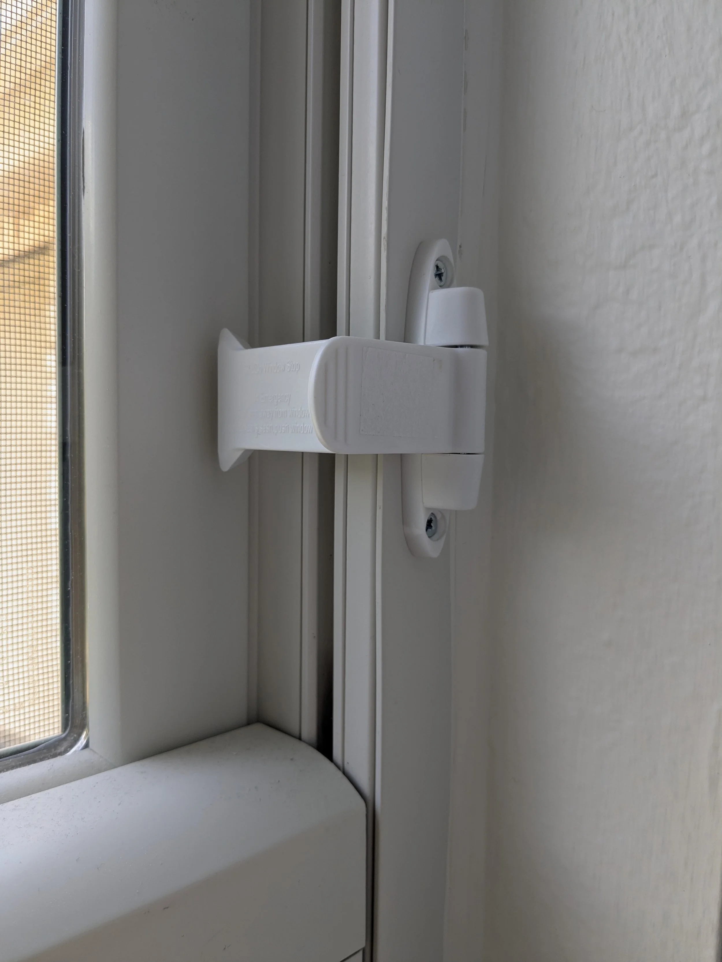 Window lock for babyproofing sliding windows on the 2nd floor
