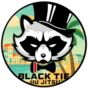 Logo of a raccoon wearing a black top hat and bowtie, with a background of a tropical cityscape and water, and text reading 'BlackTie Jiu Jitsu'.