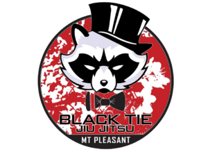 Logo featuring a raccoon wearing a black top hat and bow tie, with a red background and white splatter design, labeled 'Black Tie Jiu Jitsu, Mt Pleasant'.
