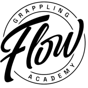 Circular logo for Grappling Flow Academy with stylized text and border.