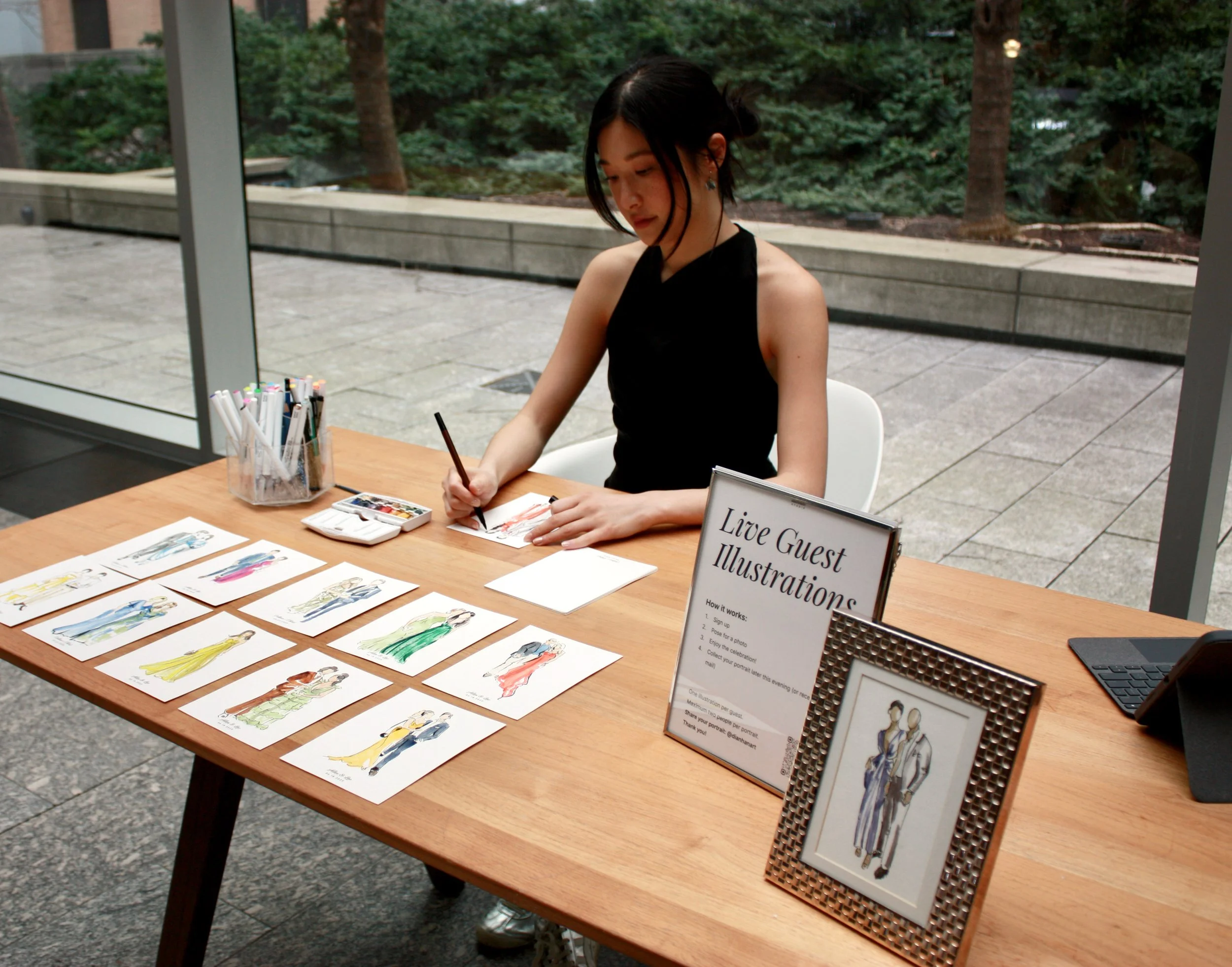 live wedding guest portrait artist painting watercolor illustrations at event in Toronto