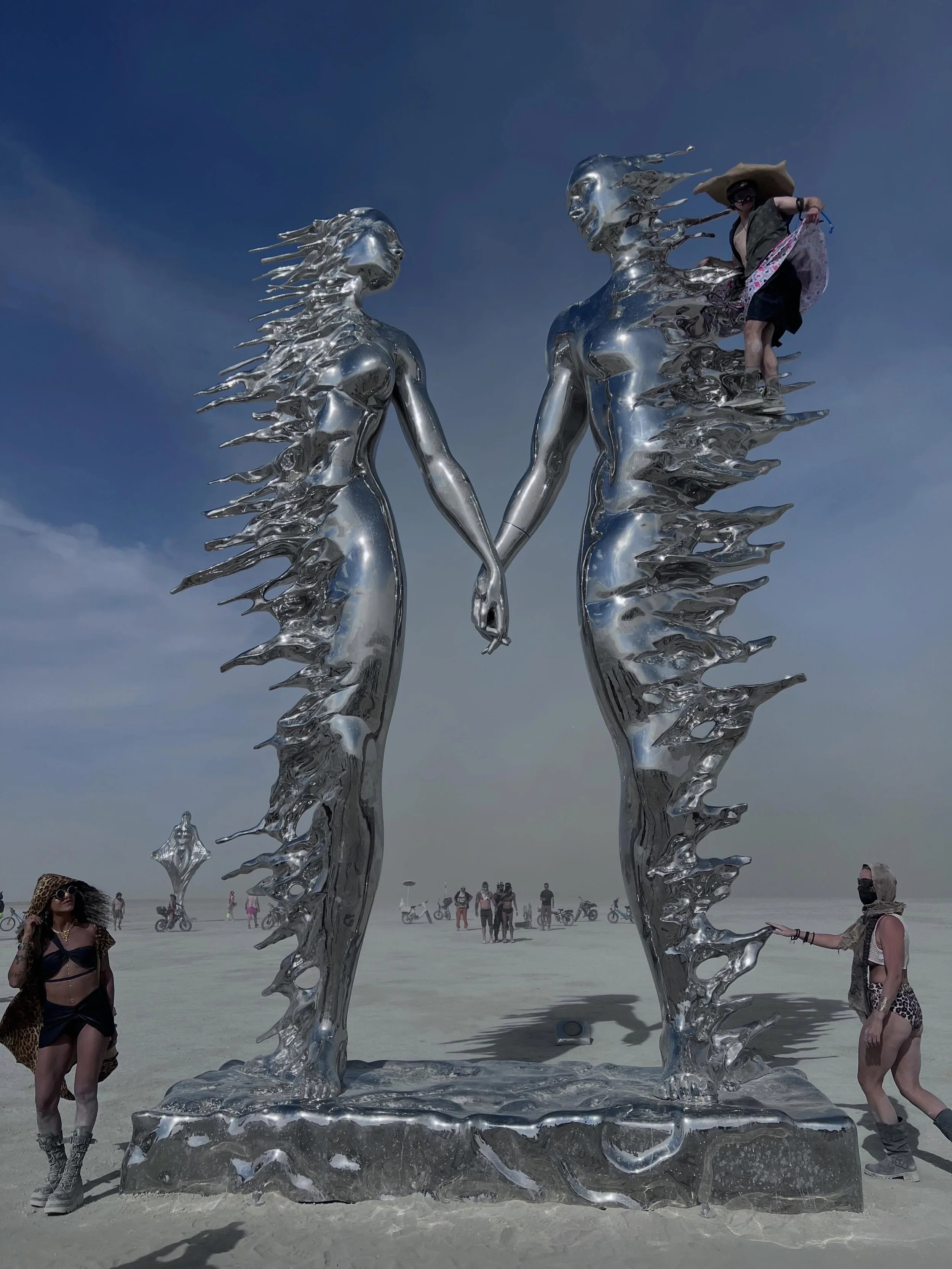 These sculptures by Michael Benisty at Burning Man moved me deeply. 

Two people, still holding hands, while their bodies seem to dissolve in opposite directions. To me, this represented integrity and honor when a relationship ends.

Nearby, a woman 