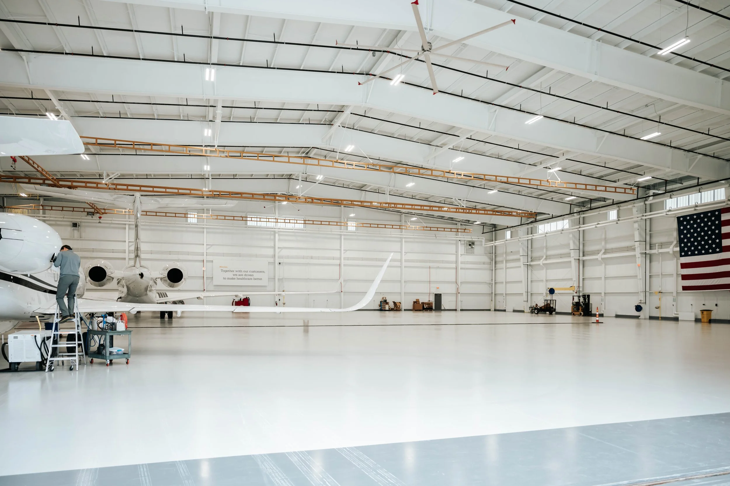 Interior of the Stryker Sky High hangar showing the clear-span PEMB steel framing and open floor