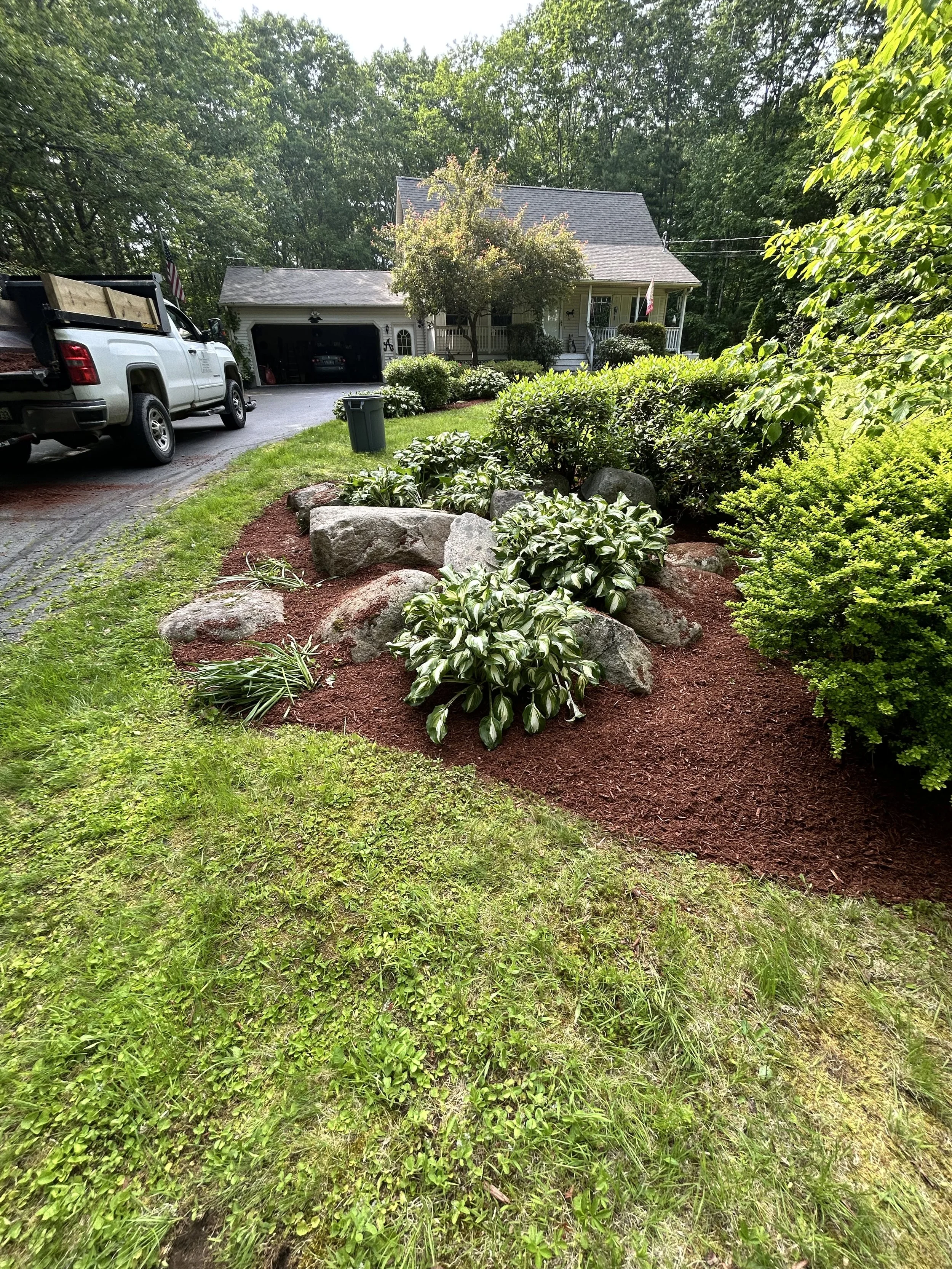 Freshly mulched bed, weeded, with a clean curved crisp edge