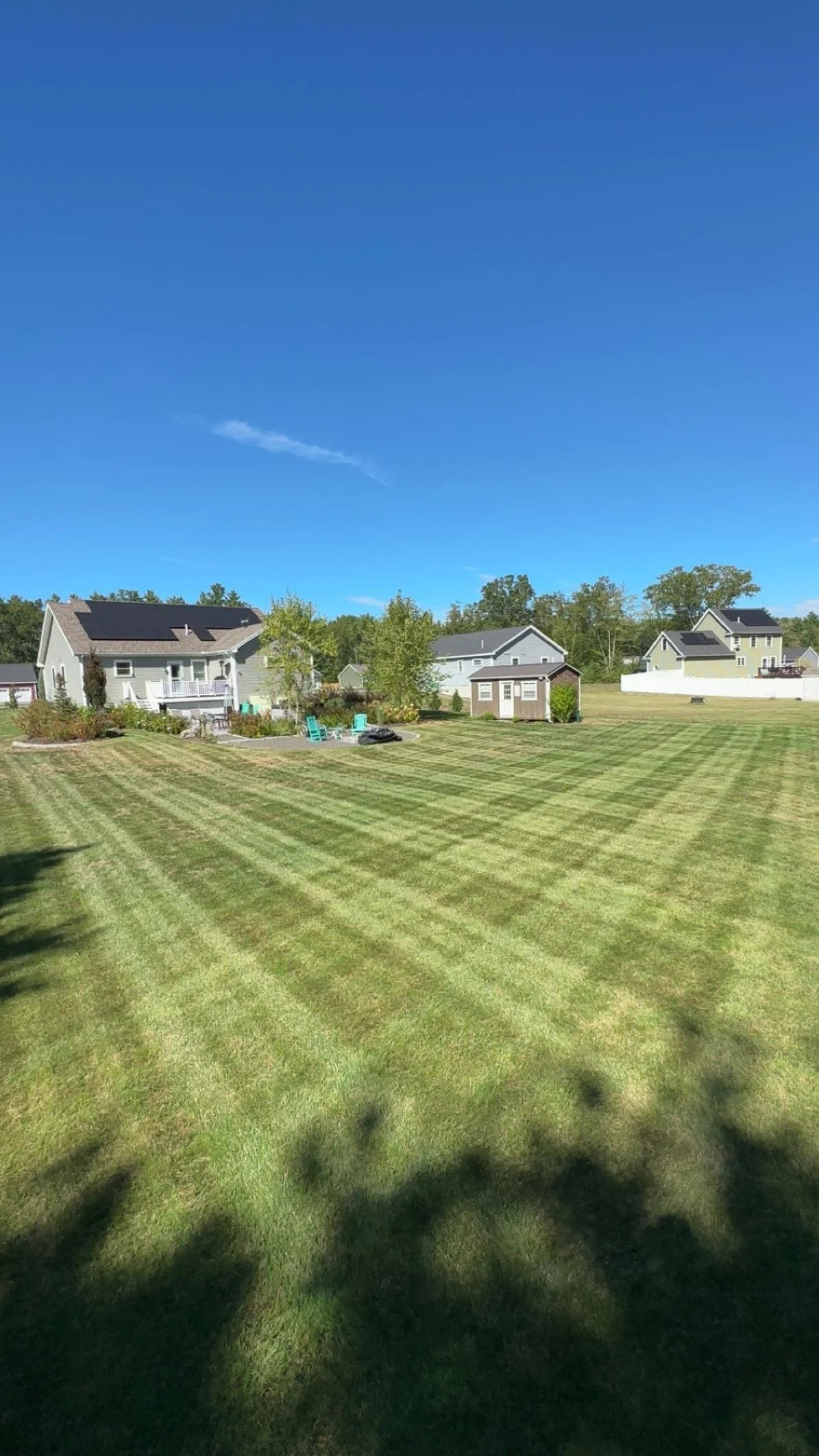 Lawn freshly cut with clear stripes in grass