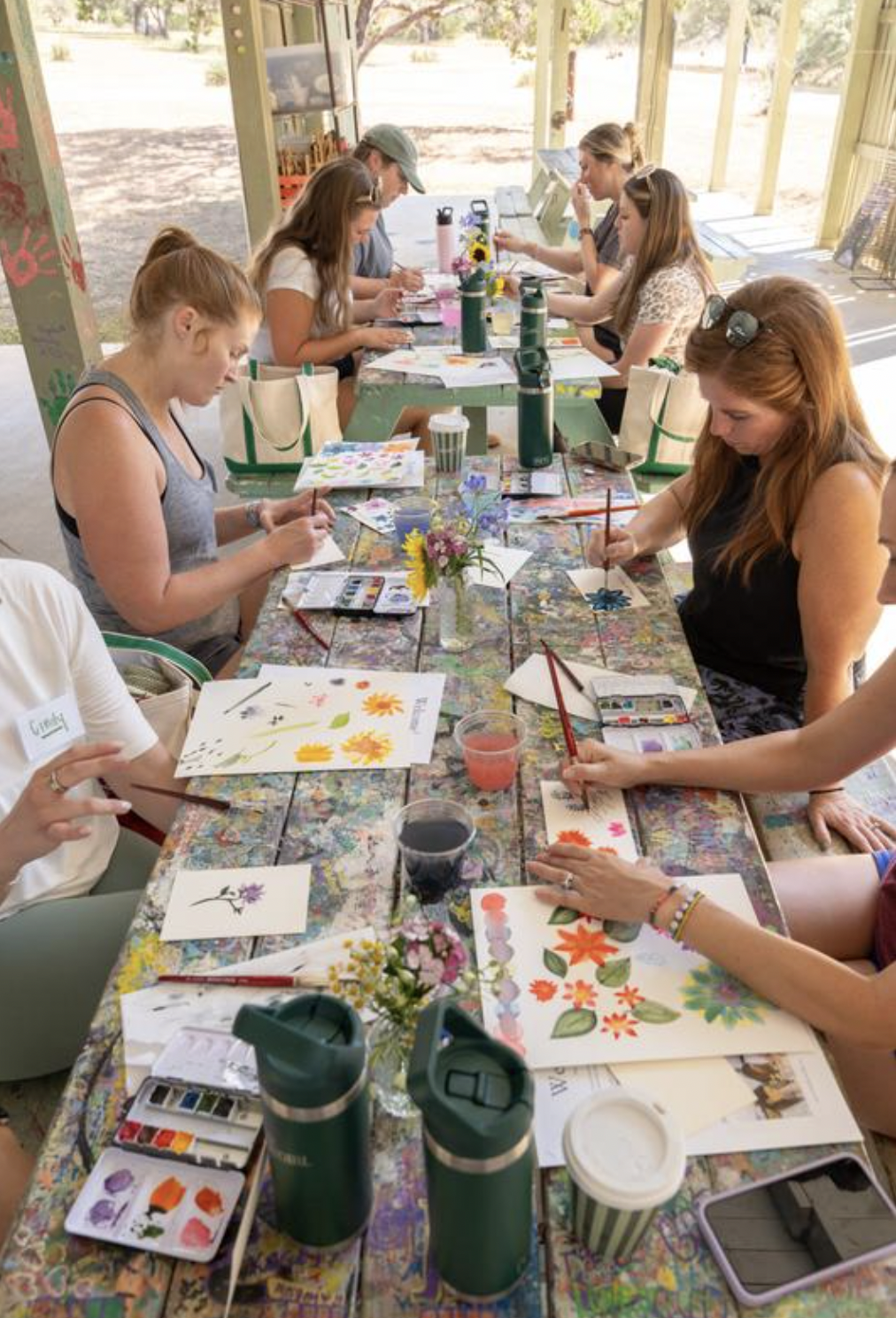 creative workshops include watercoloring, bedazzling, and needlepoint